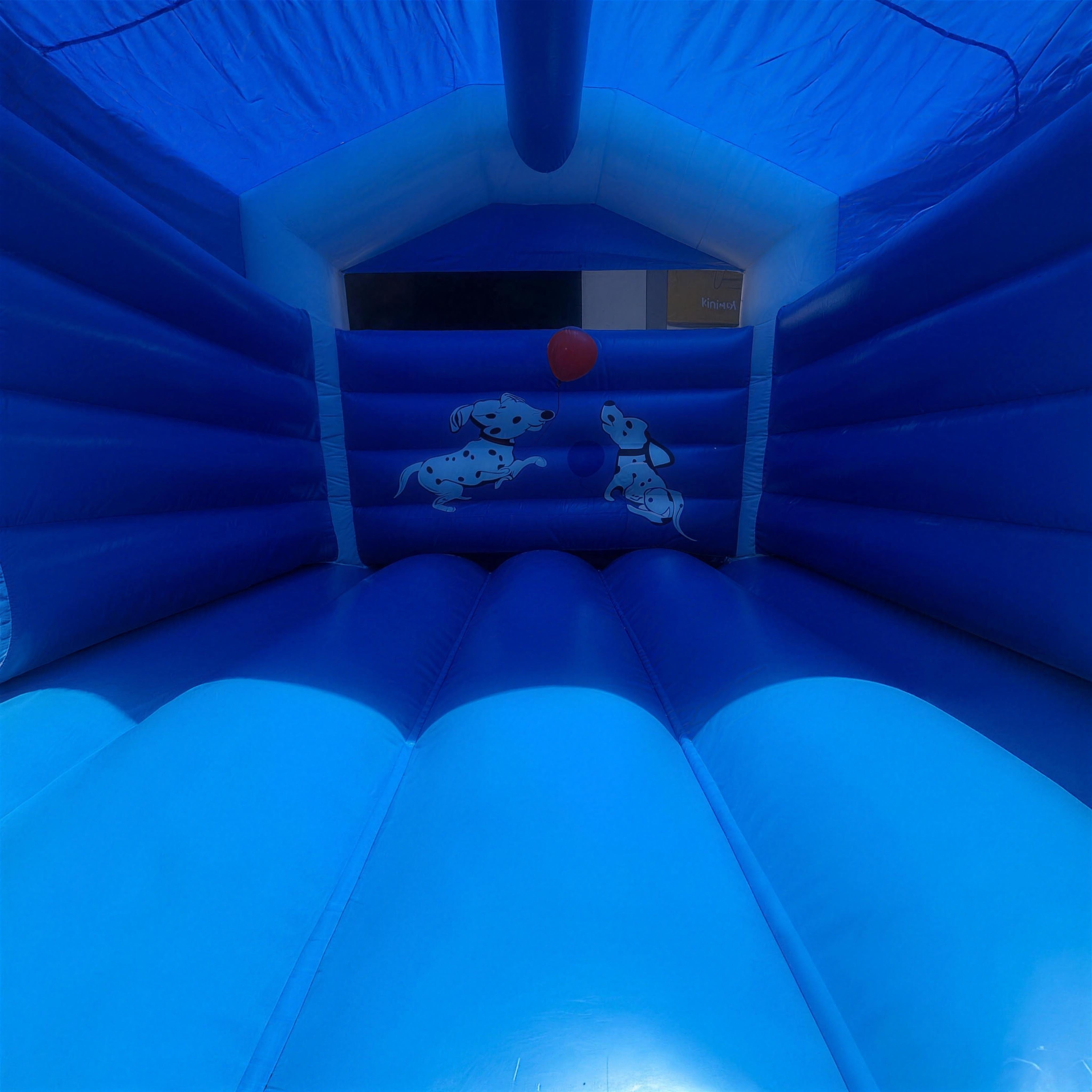 Interior of the 101 Dalmatians jumping castle bounce area, with a printed illustration of two dalmatian puppies on the back wall.