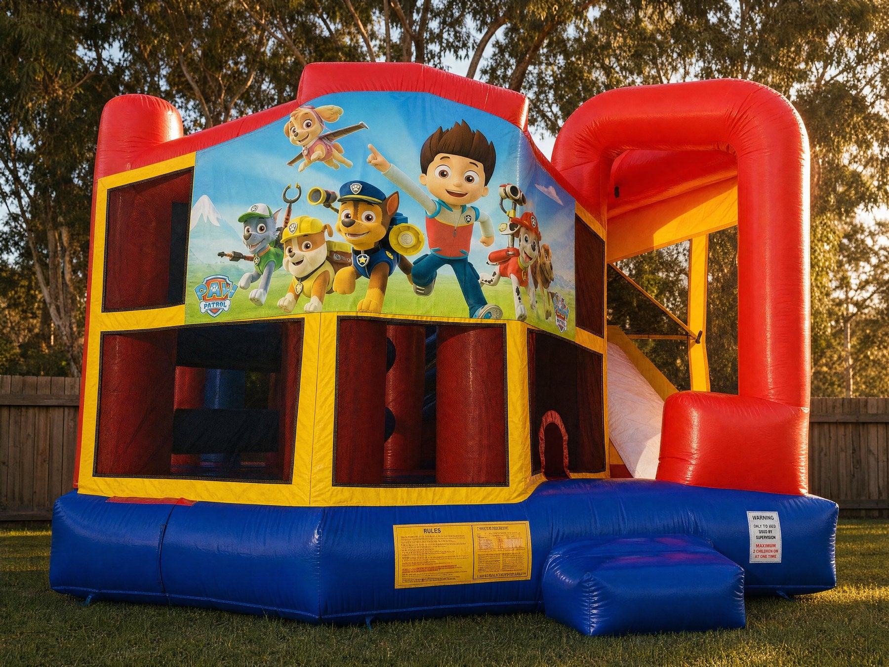 Front view landscape photo of the 5in1 Banner Castle Combo (shown with the Paw Patrol banner, choose your theme at booking)