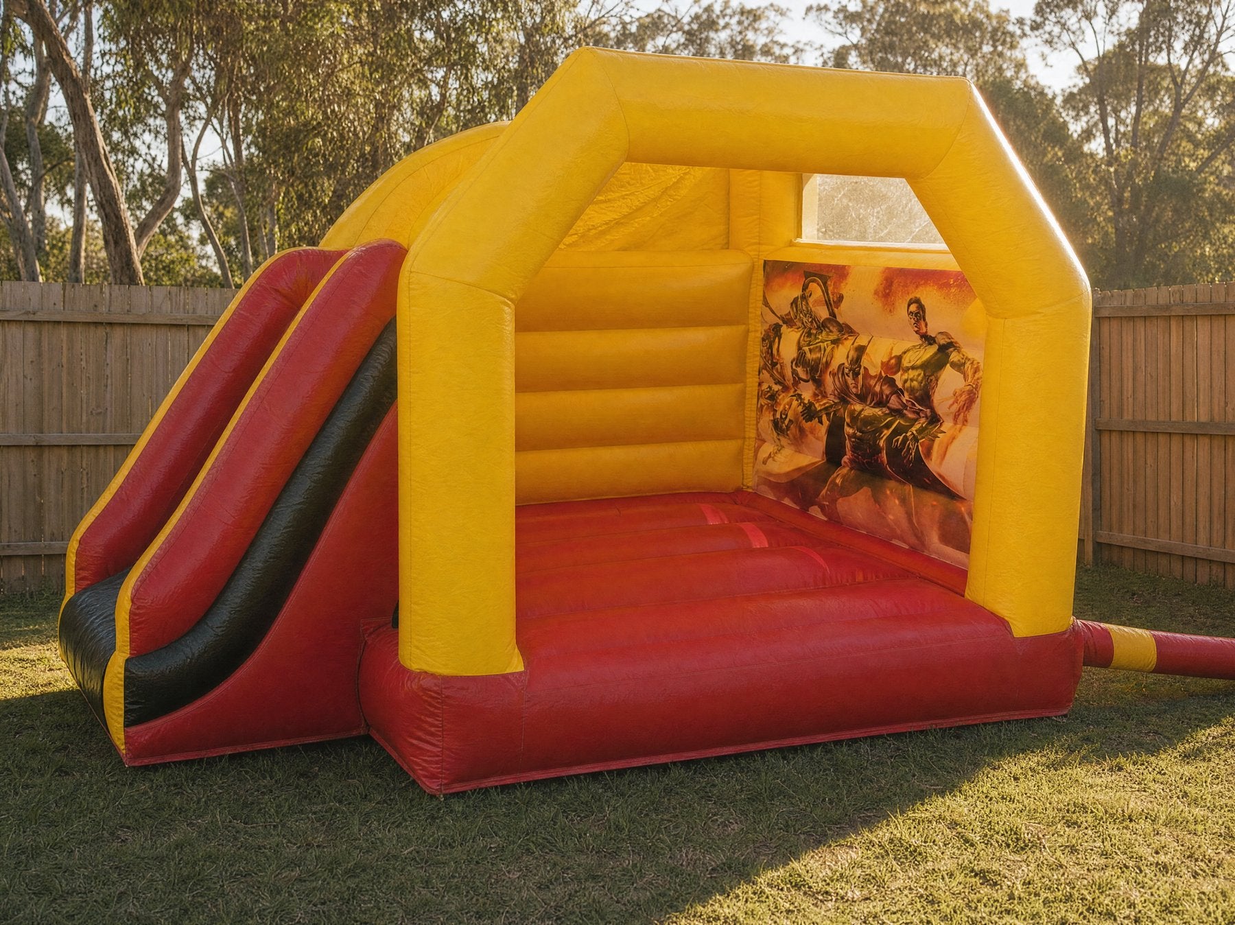 Batman Castle with Slide Combo Hire Central Coast - interior peek showing the printed mural