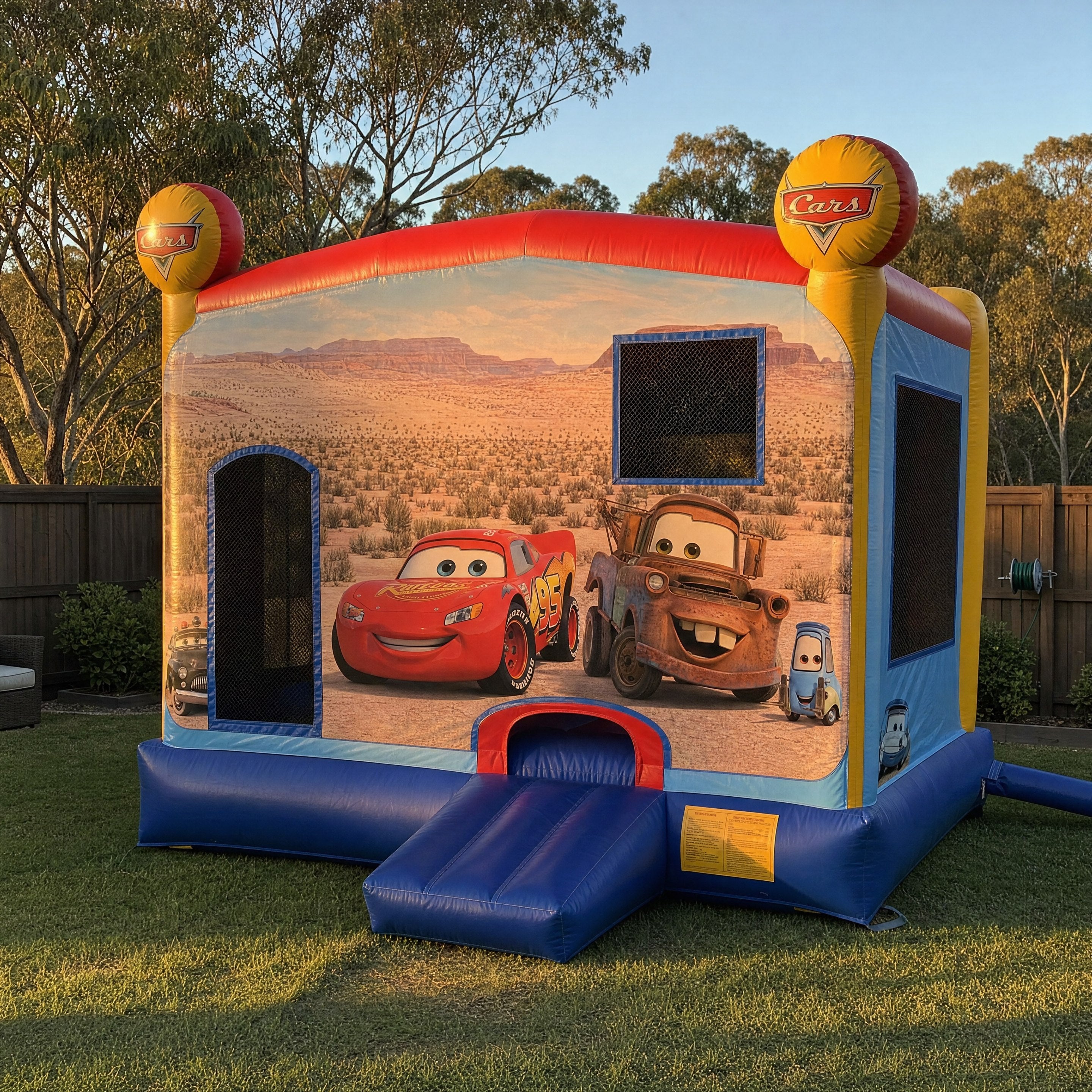 Cars C4 Combo castle front view with Lightning McQueen and Mater artwork and entry ramp