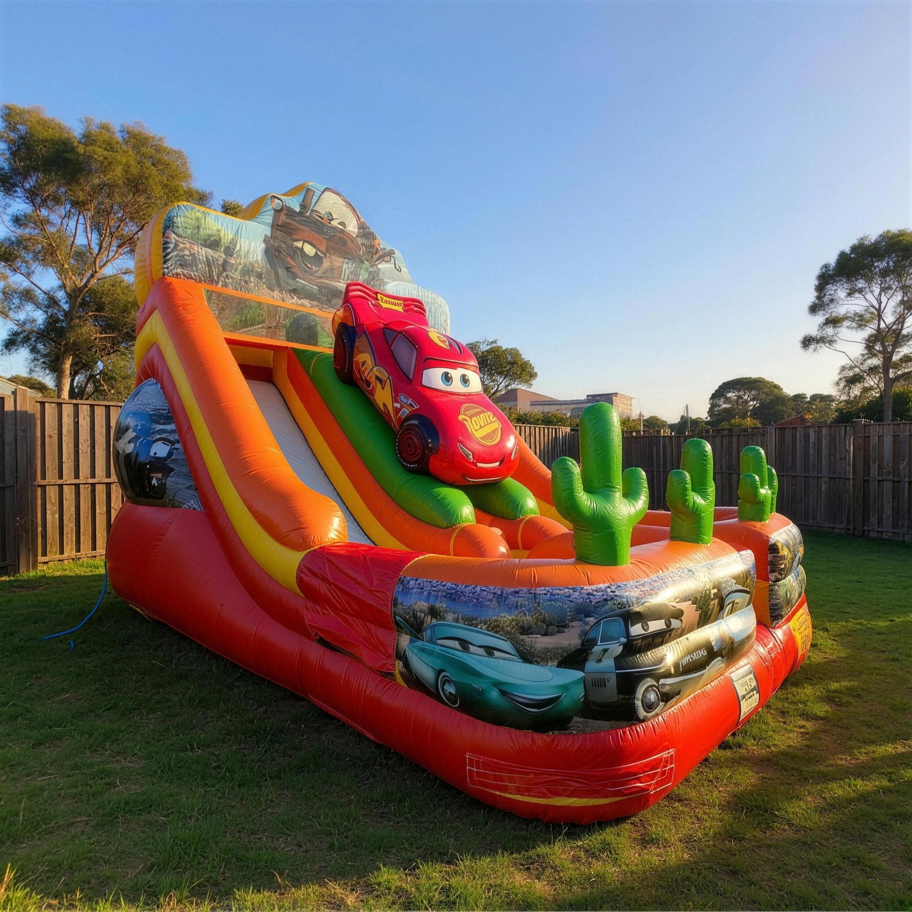 Cars Double Lane Dry Slide Hire - pulled back view showing true size in a backyard