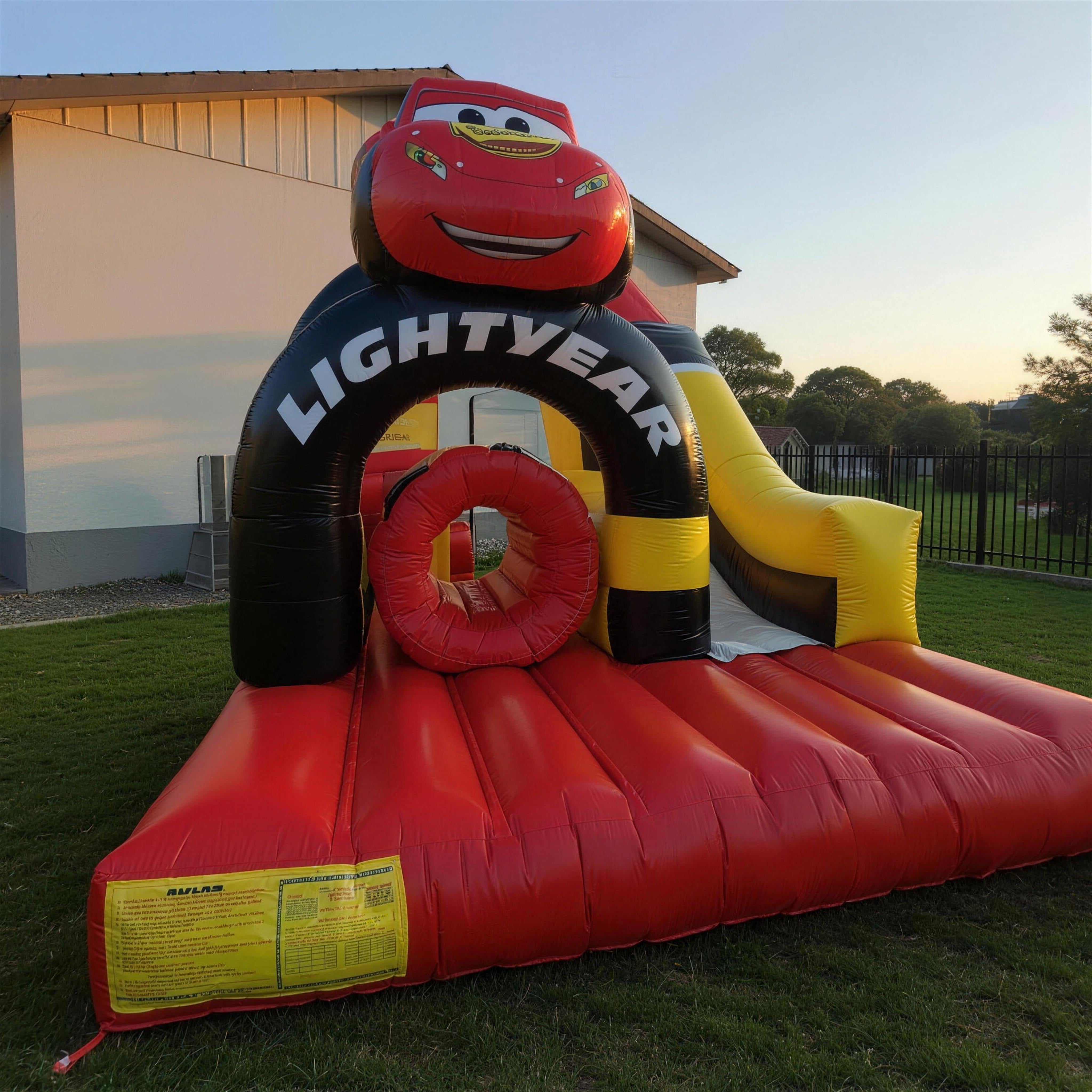 Cars Obstacle Challenge inflatable with Lightning McQueen topper in a Central Coast backyard