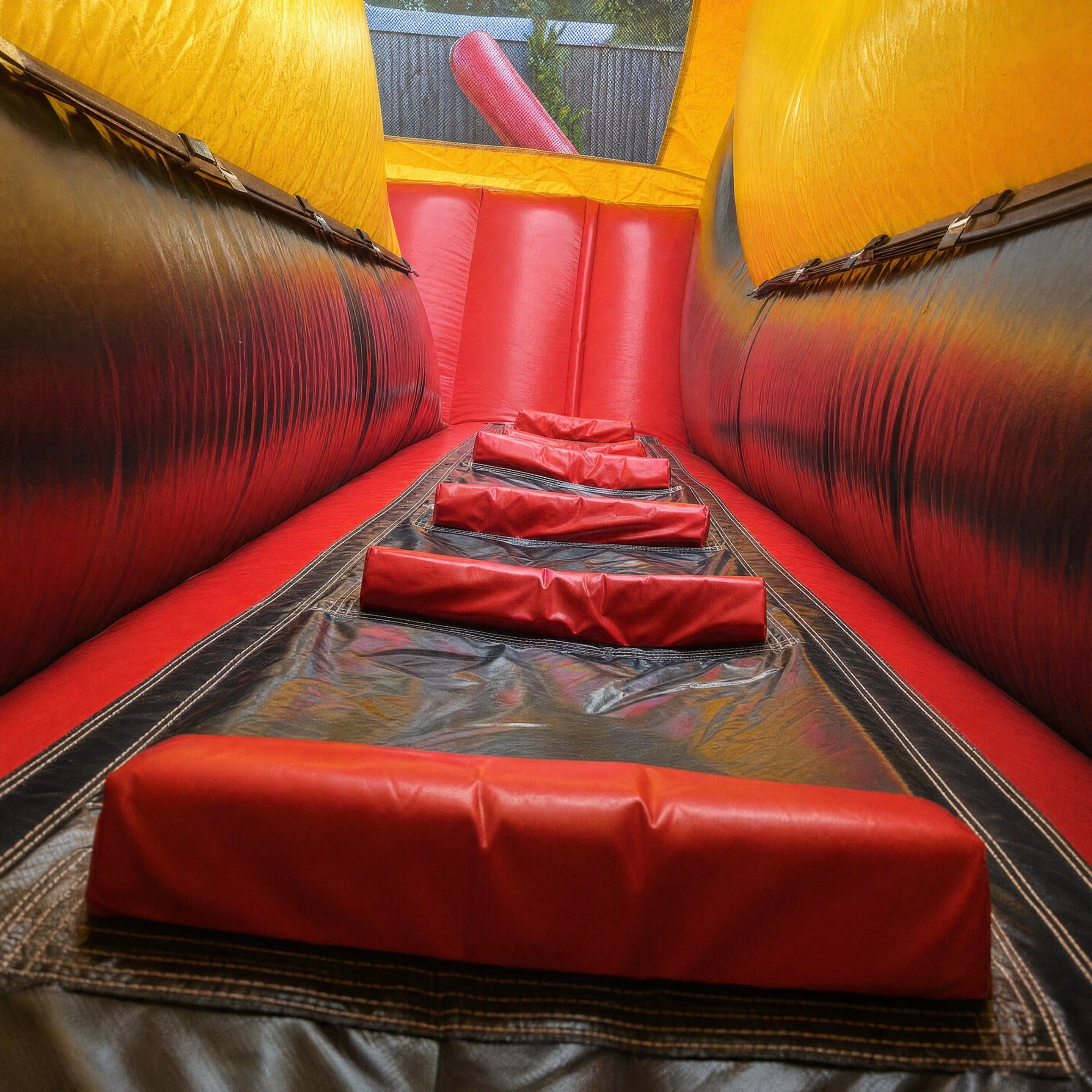Interior obstacle lane with padded bolsters inside the Cars Obstacle Challenge