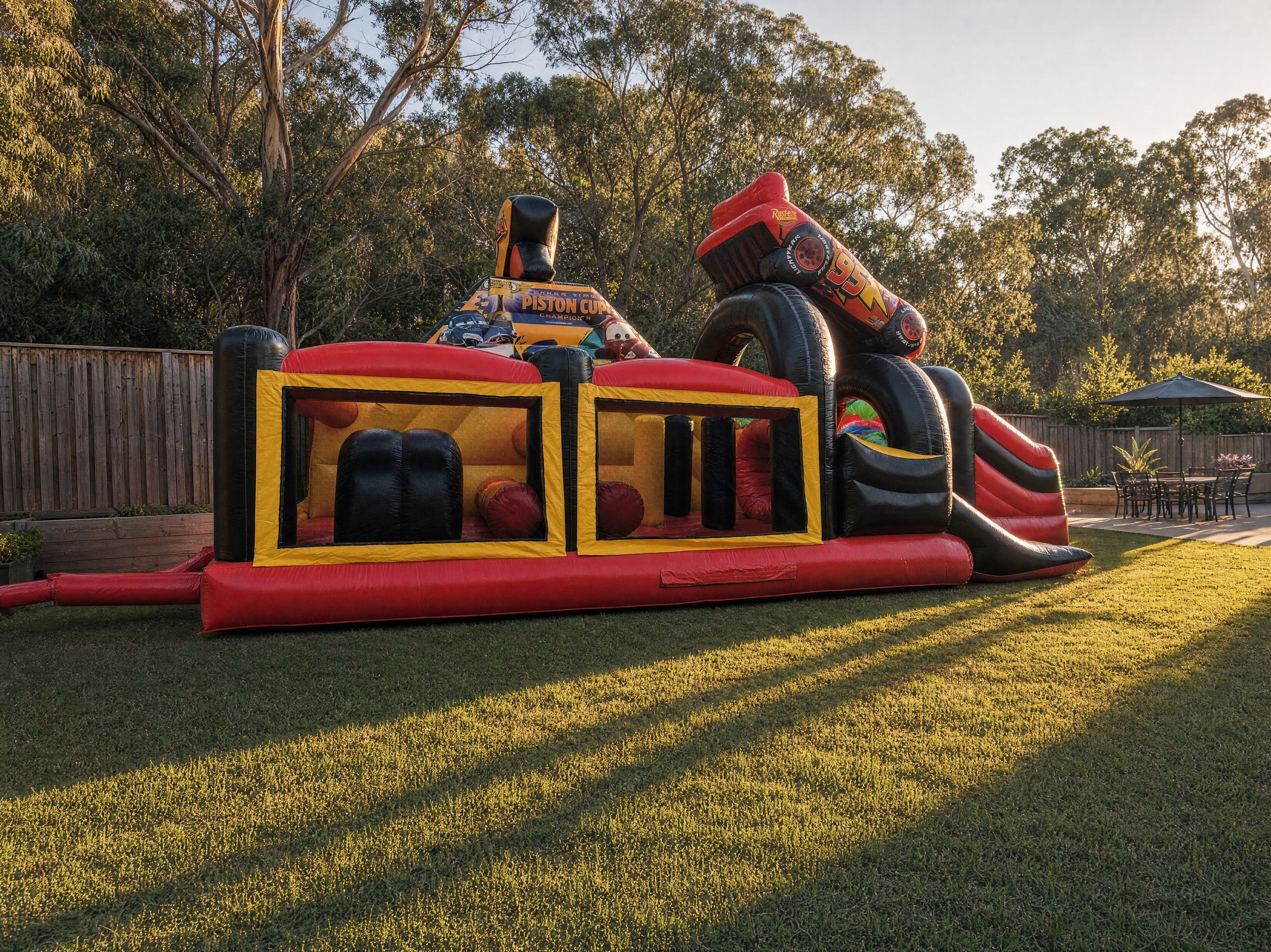 Full length view of the Cars Obstacle Challenge obstacle course in a backyard