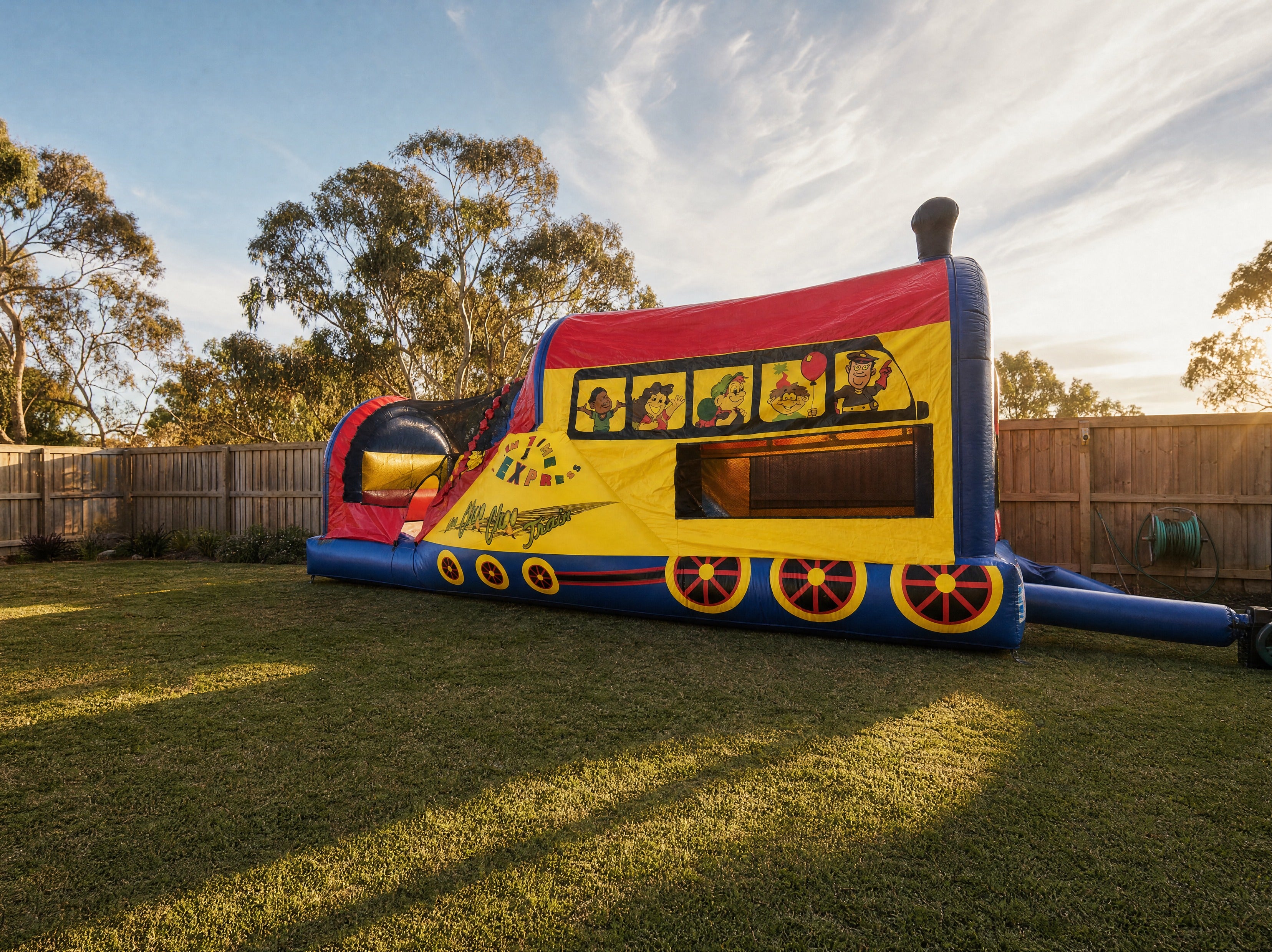 Choo Choo 3in1 Combo jumping castle shown at true scale in a Central Coast backyard