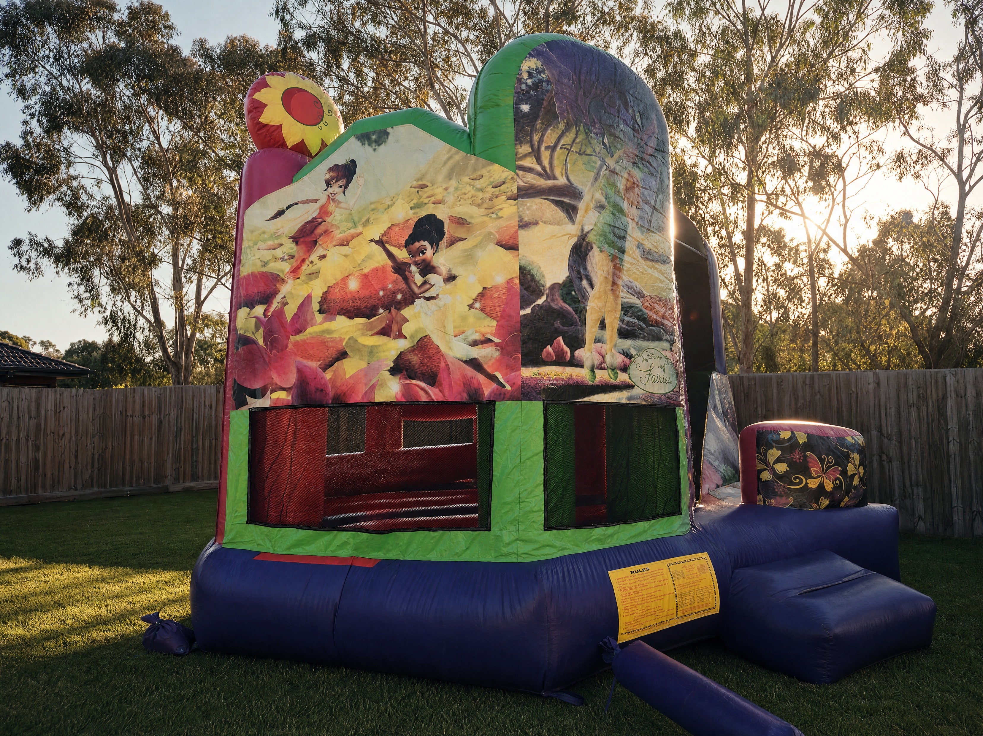 Disney Fairies 5in1 Combo jumping castle hire, wide front three-quarter view, Central Coast backyard