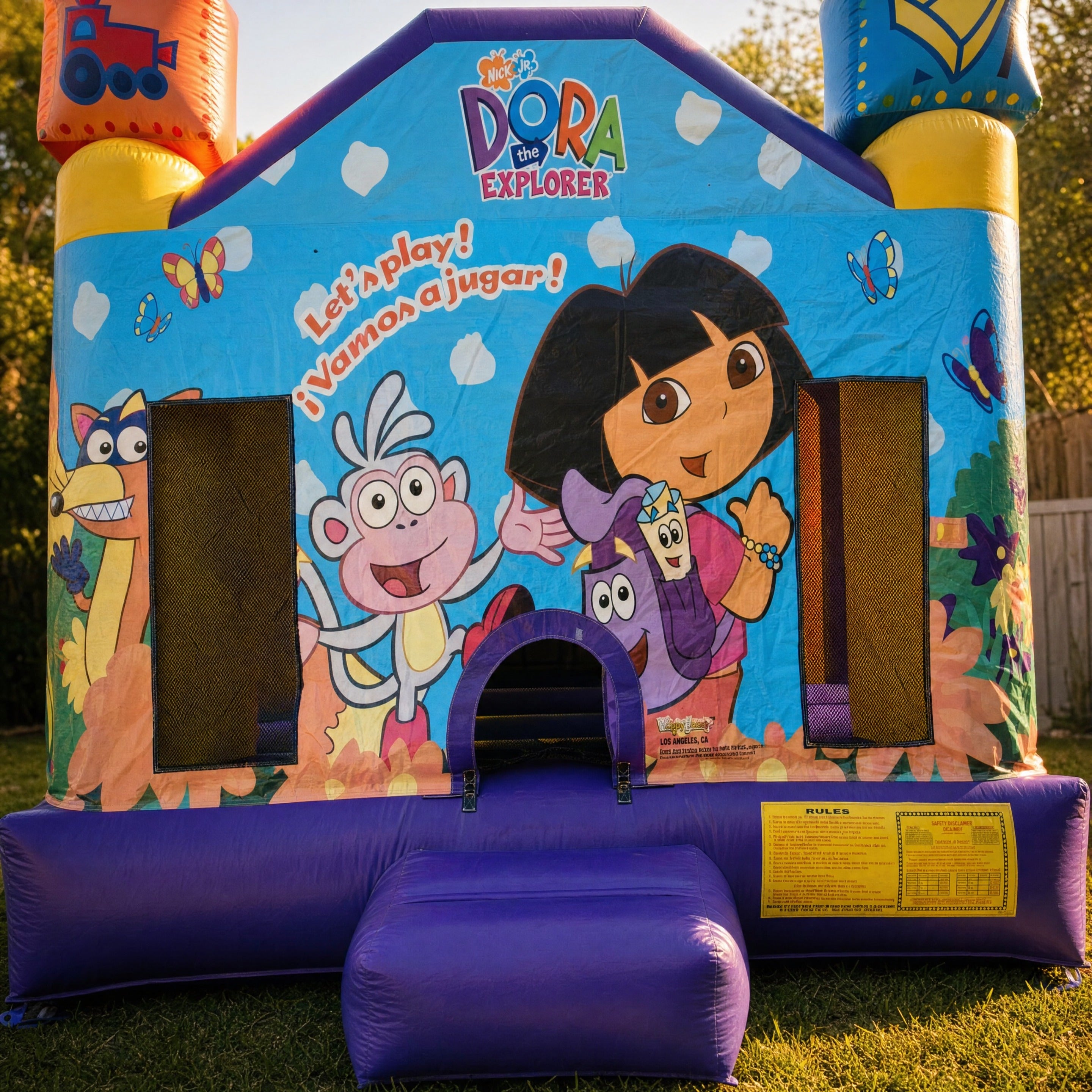Dora Jumping Castle entrance archway and safety placard detail