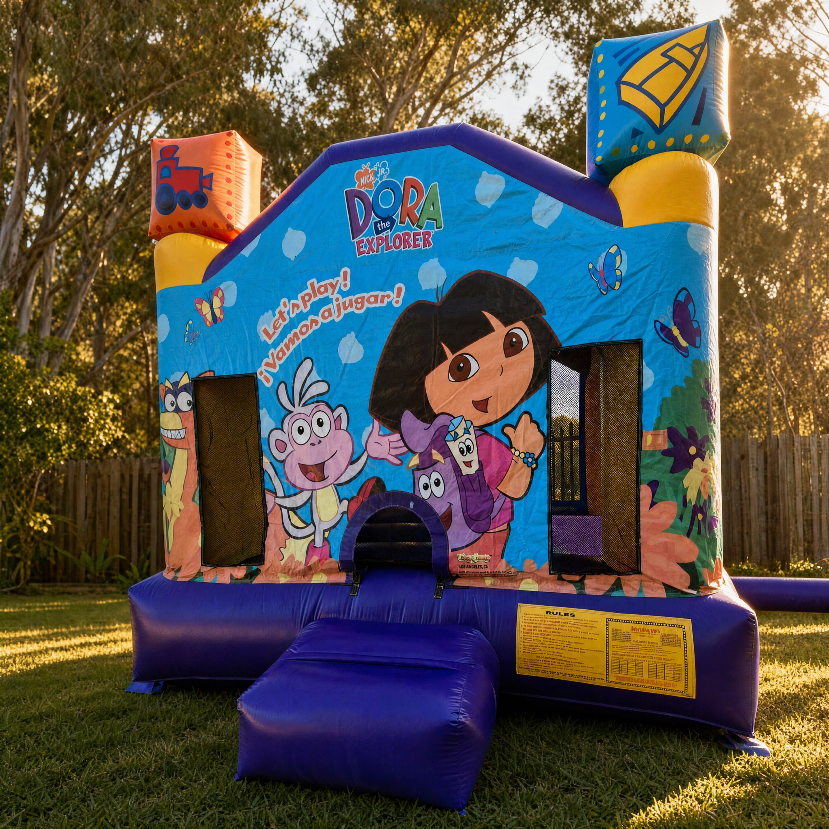 Dora Jumping Castle set up in a Central Coast backyard, front three-quarter hero view with Dora the Explorer artwork