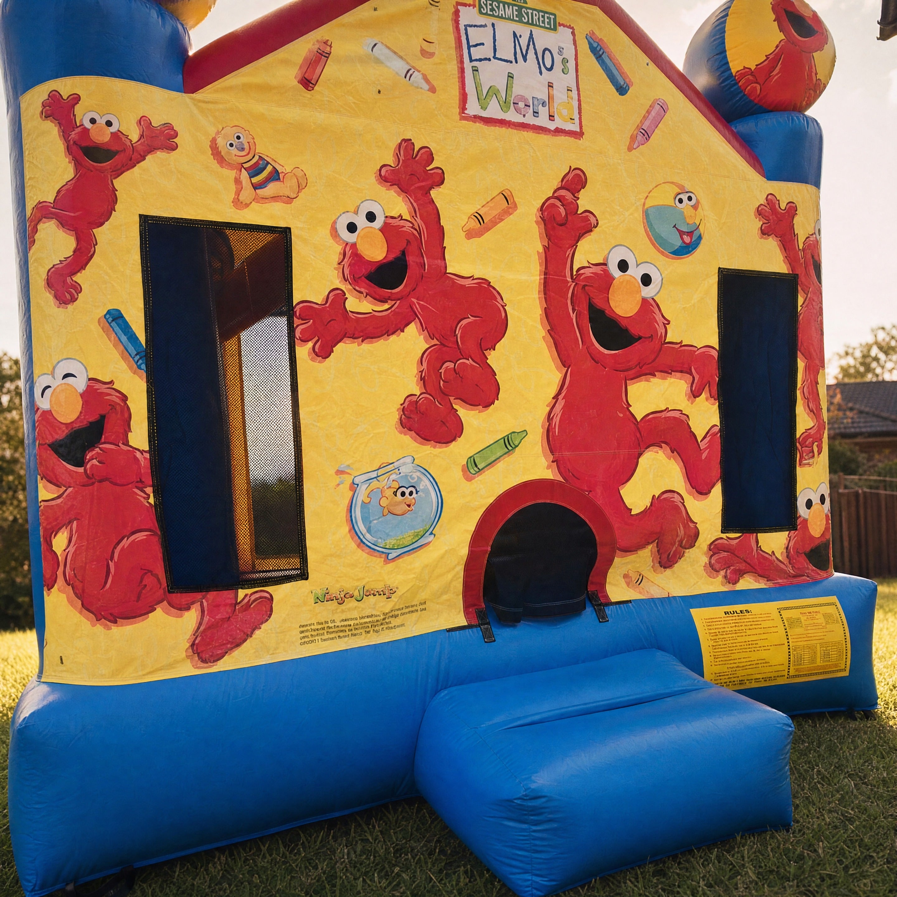 Elmo's World Jumping Castle entrance archway and safety rules placard detail