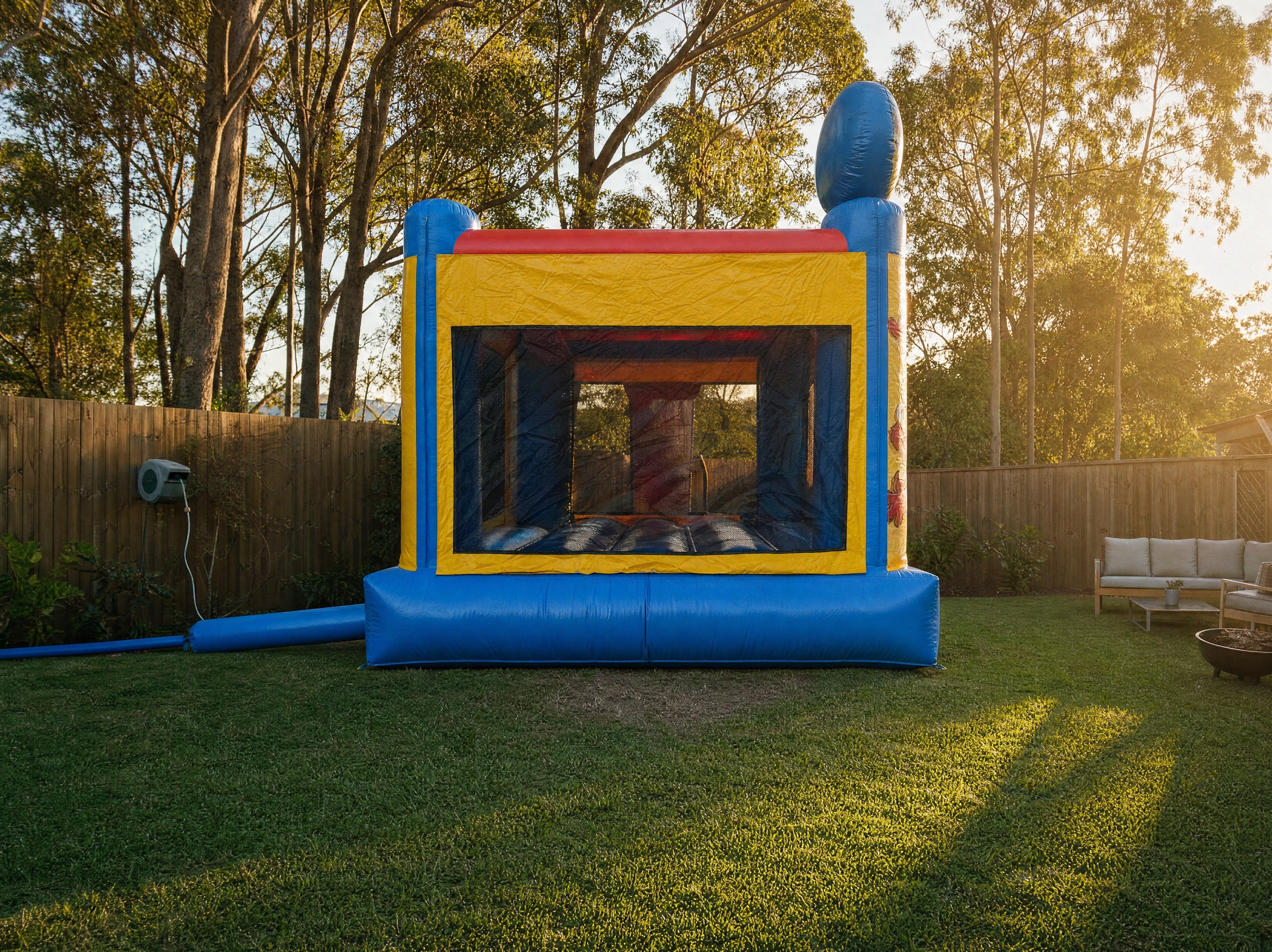 Elmo's World Jumping Castle shown at true scale in a Central Coast backyard