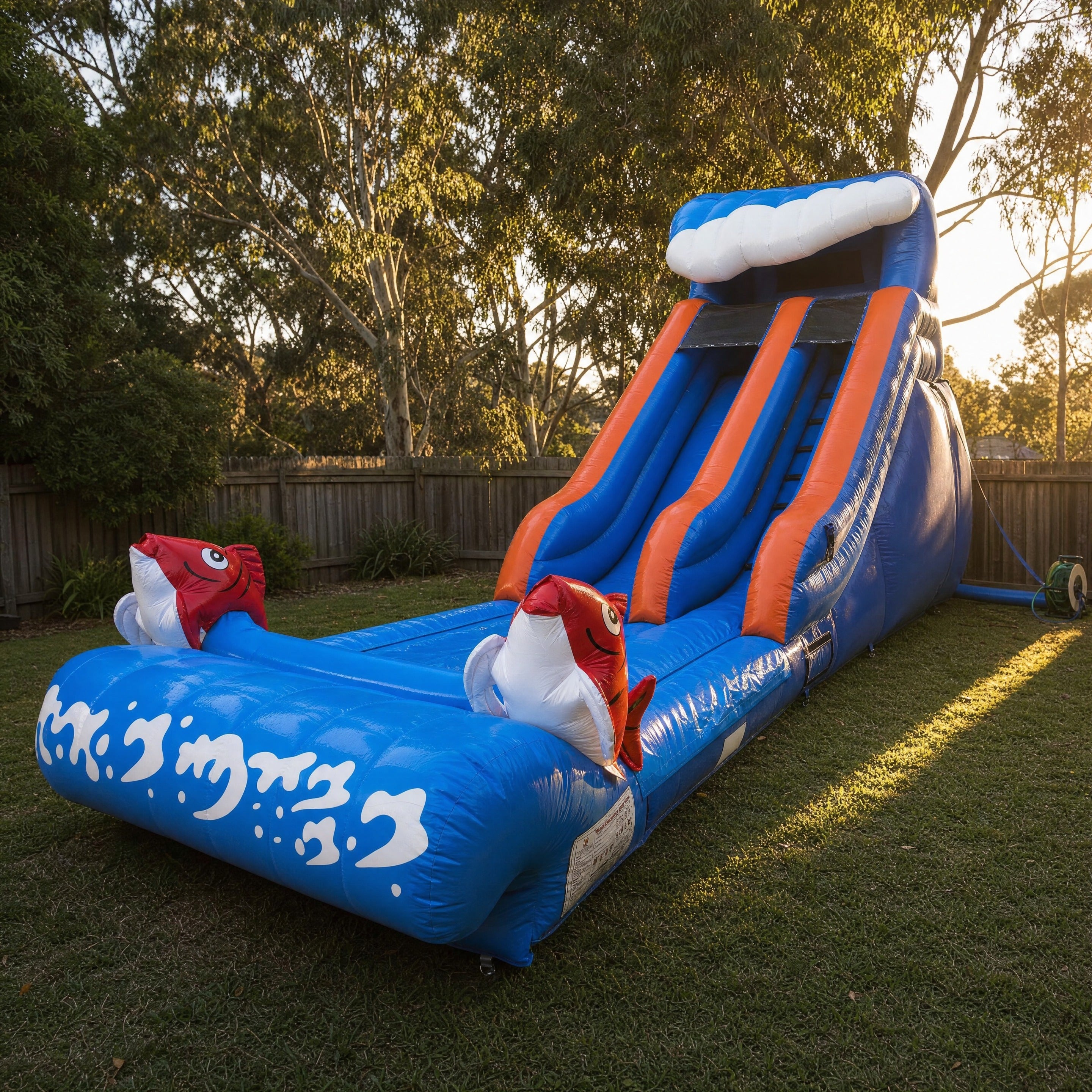 Fish World Water Slide Hire, Central Coast - front three-quarter view with fish toppers and landing pool
