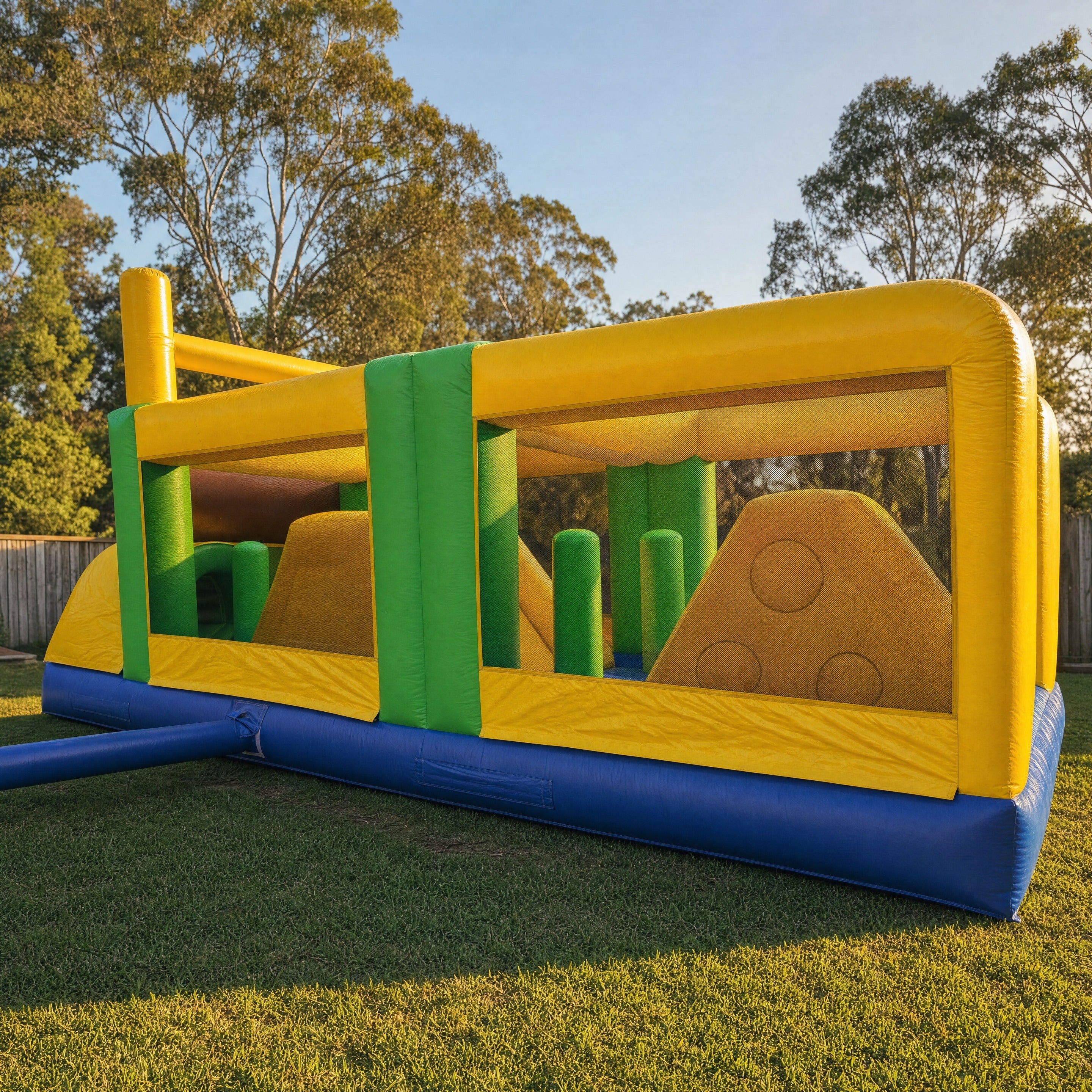 Footy Obstacle Challenge football themed inflatable obstacle course in a Central Coast backyard