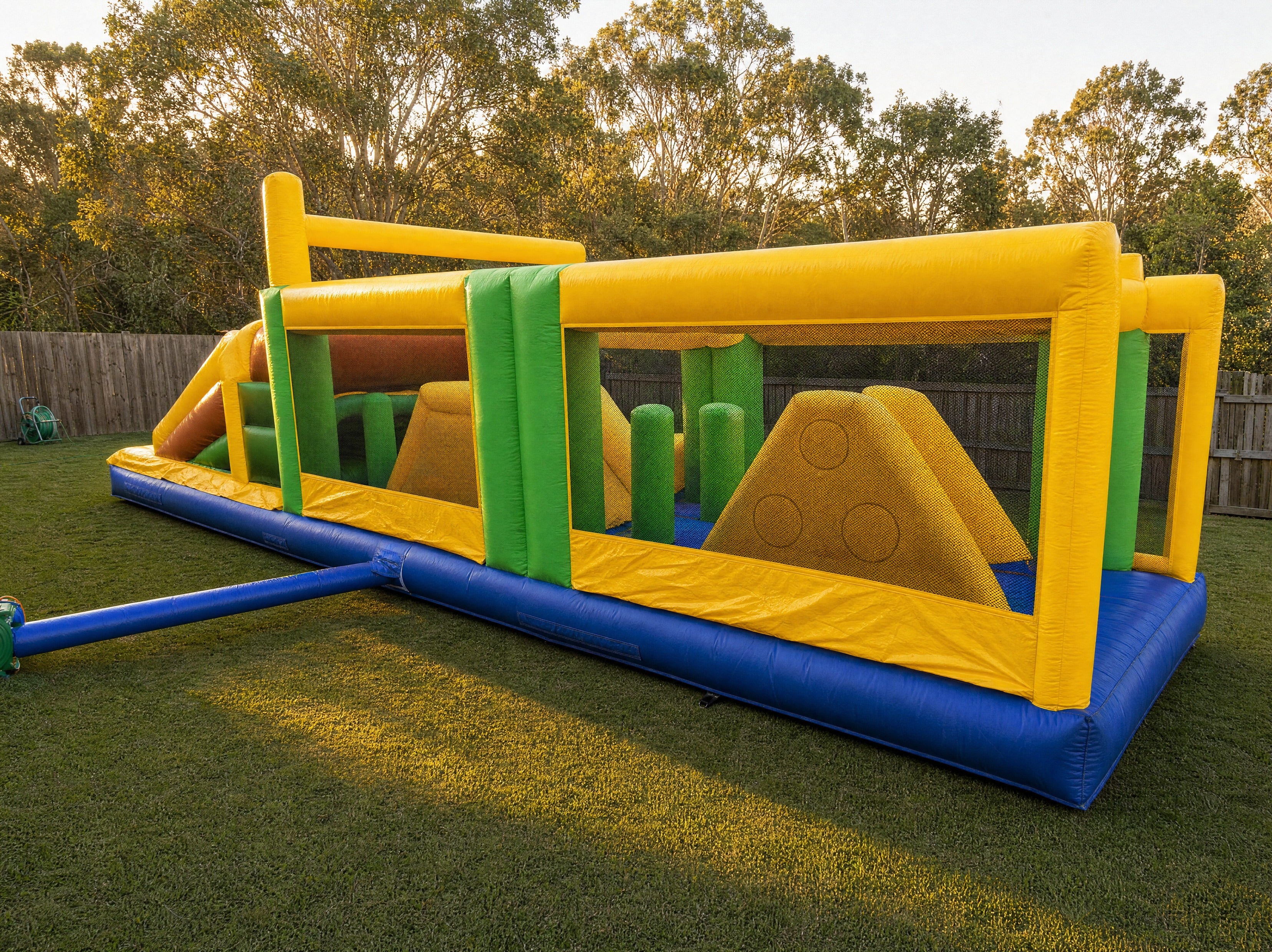 Wide view of the full length Footy Obstacle Challenge in a real Central Coast backyard