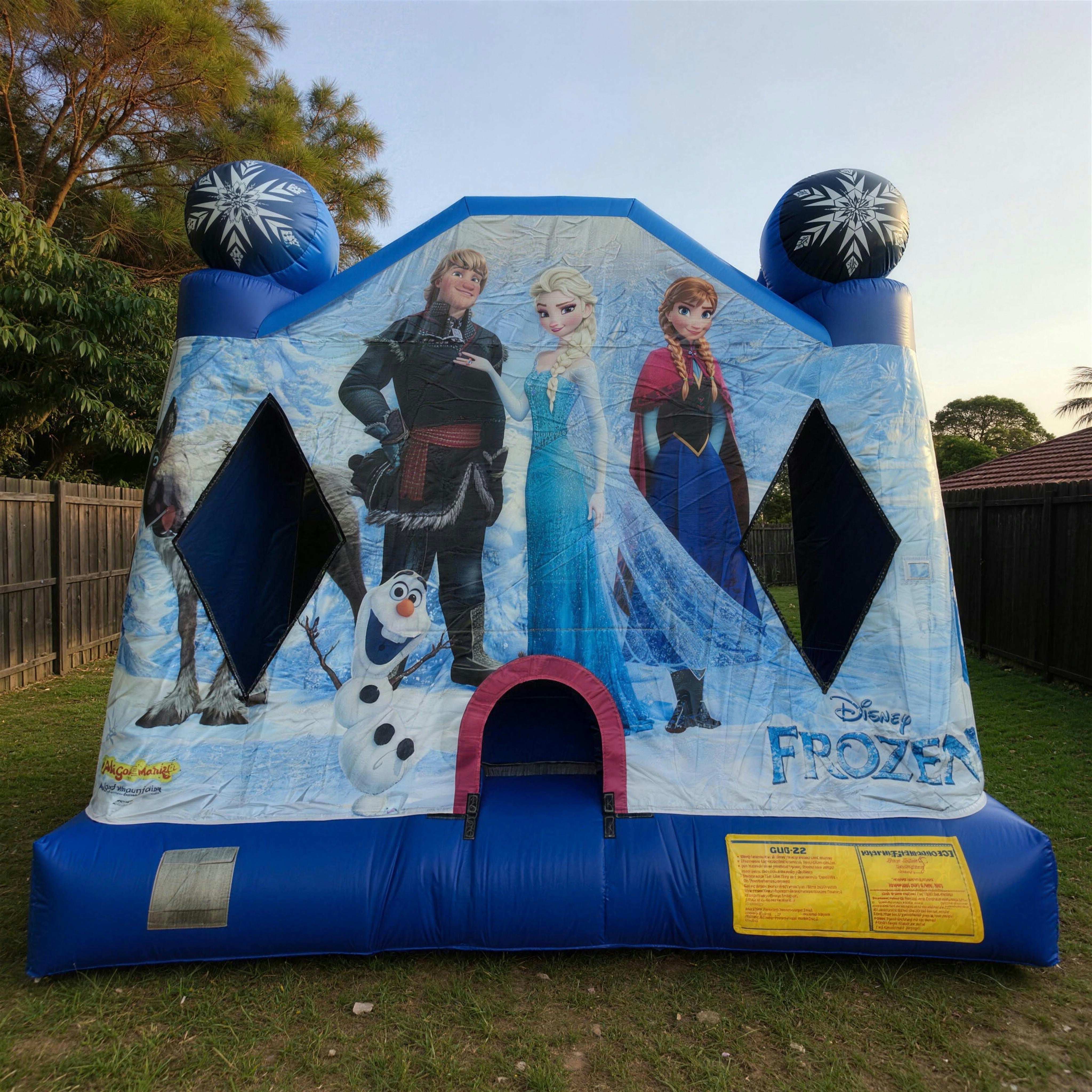 Front elevation of the Frozen Jumping Castle showing Disney Frozen character panel artwork