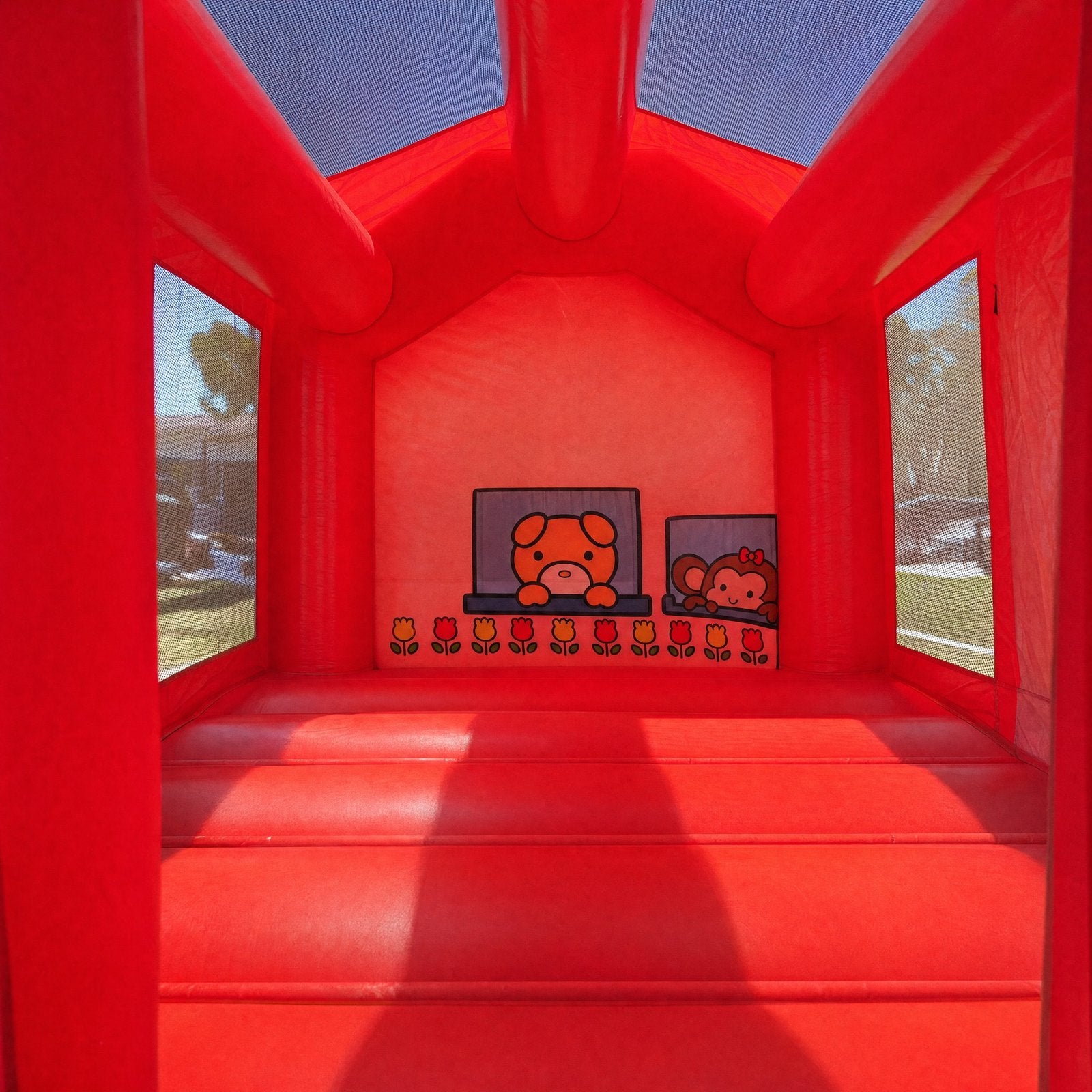 Interior view of the Hello Kitty C7 Combo castle showing the printed Sanrio character mural
