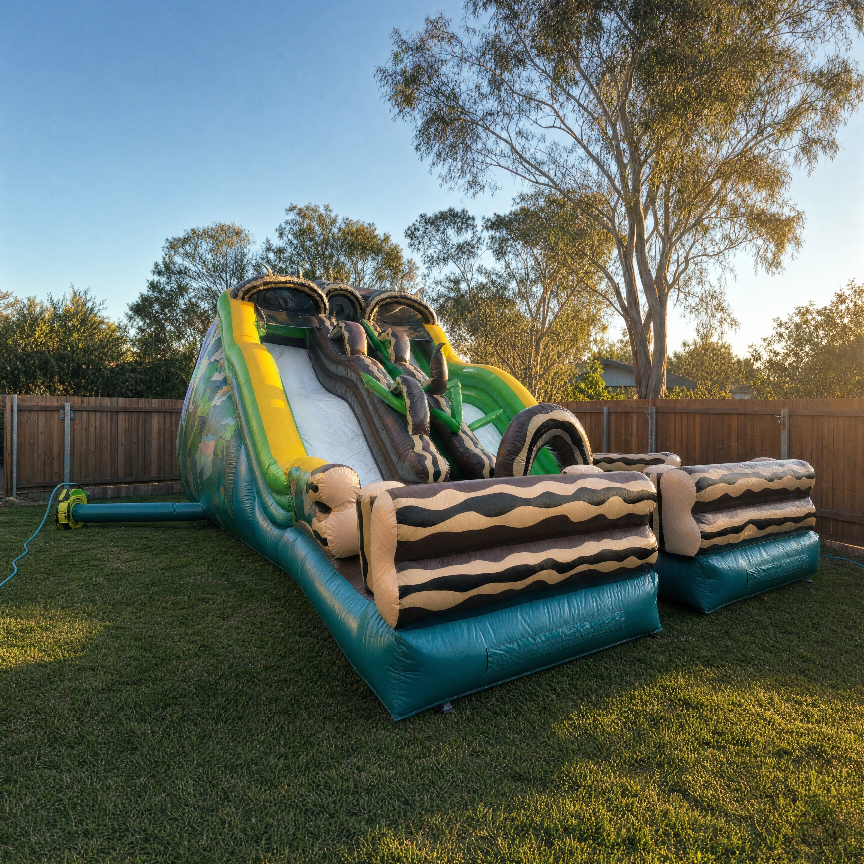 Jungle Double Lane Water Slide Hire - low angle view showing true size in a backyard