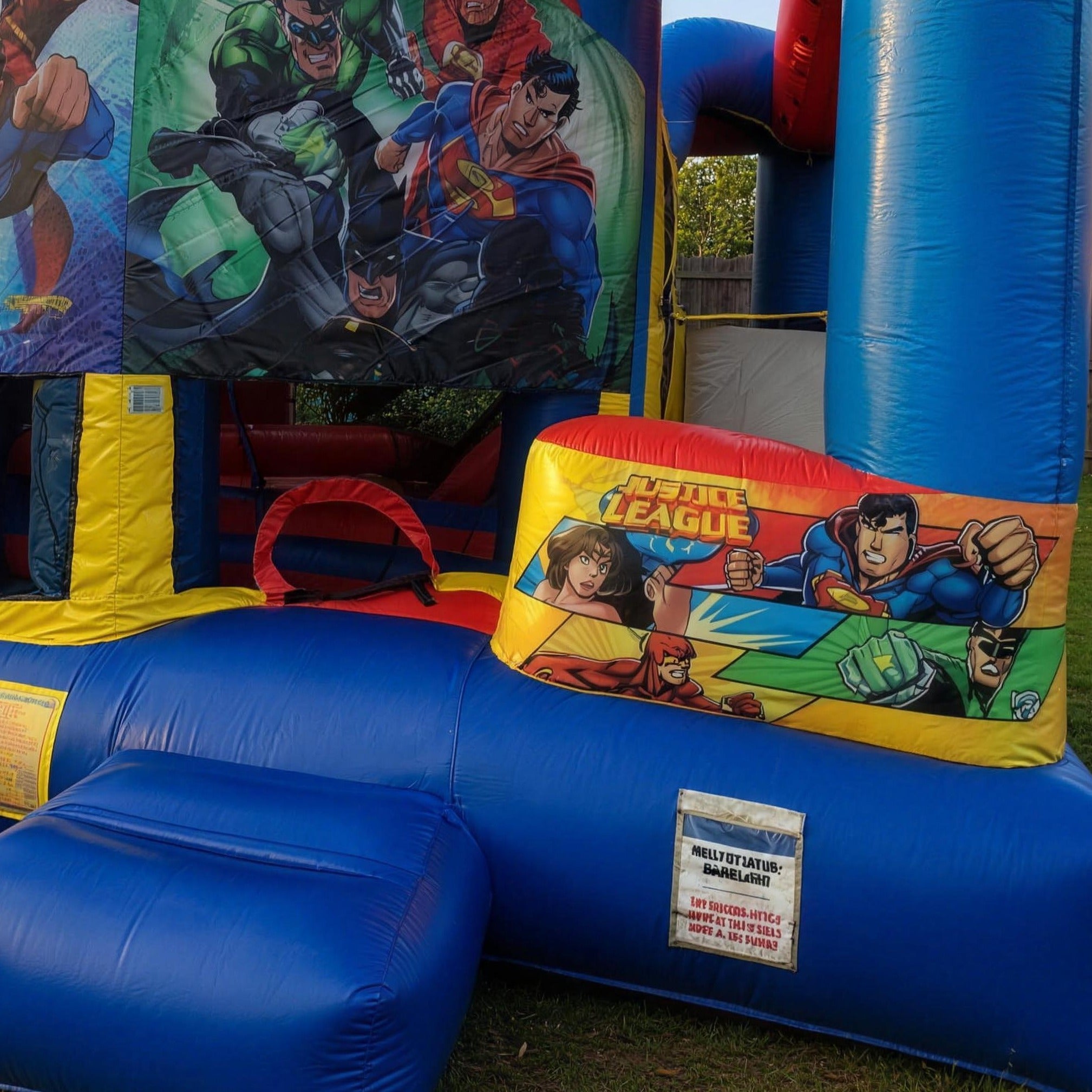 Justice League 5in1 Combo hire castle showing the Justice League banner in a Central Coast backyard