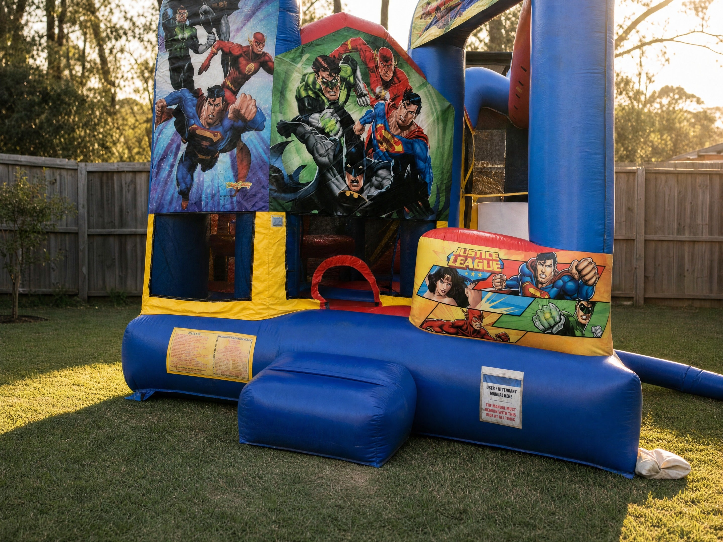 Justice League 5in1 Combo jumping castle hire wide hero view in a Central Coast backyard