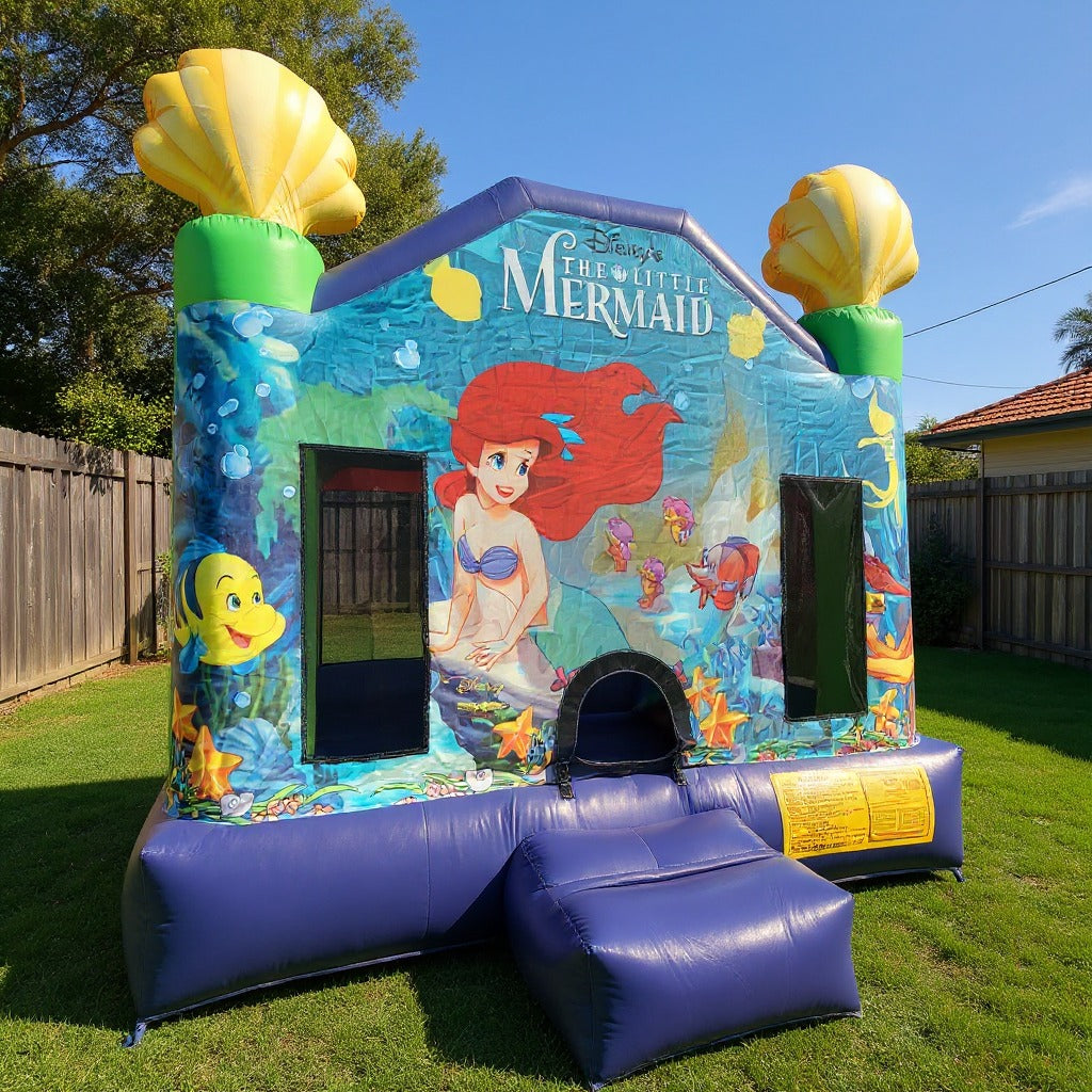 Little Mermaid Jumping Castle - alternate three-quarter side angle in the backyard
