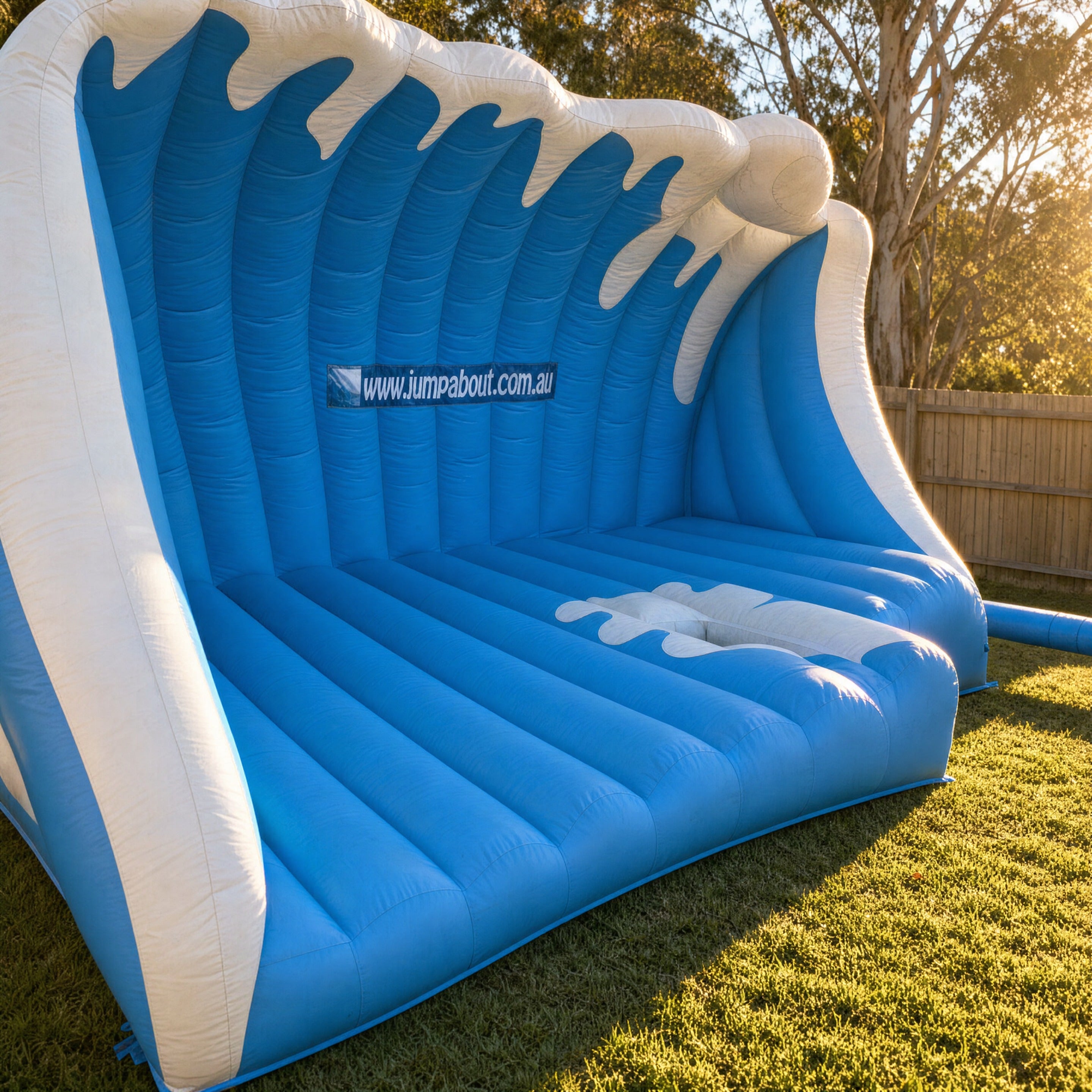 Close view inside the Mechanical Surfboard's wave-shaped inflatable, showing the ribbed interior and Jump About branding