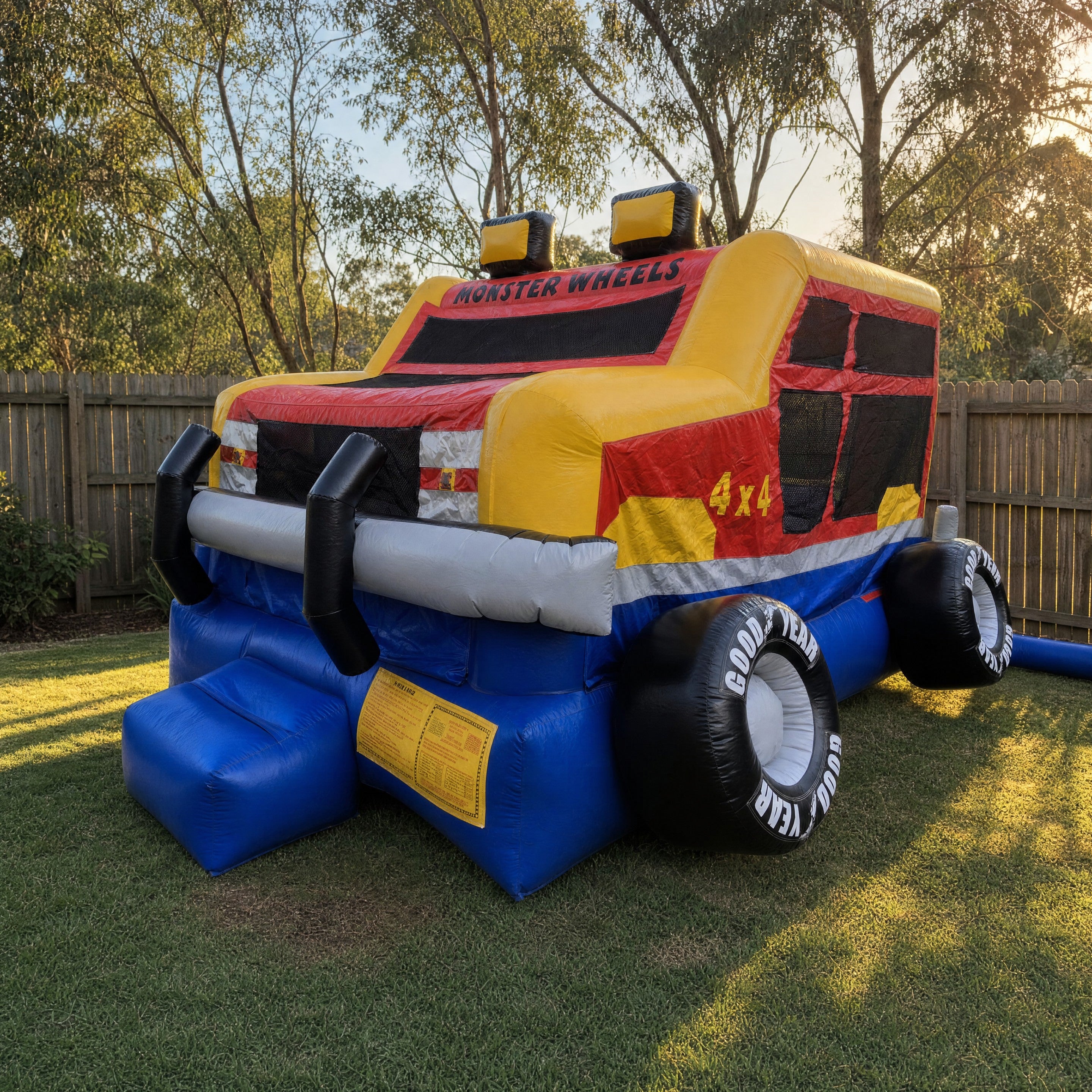 Monster Wheels Castle Combo hire set up in a Central Coast backyard at golden hour