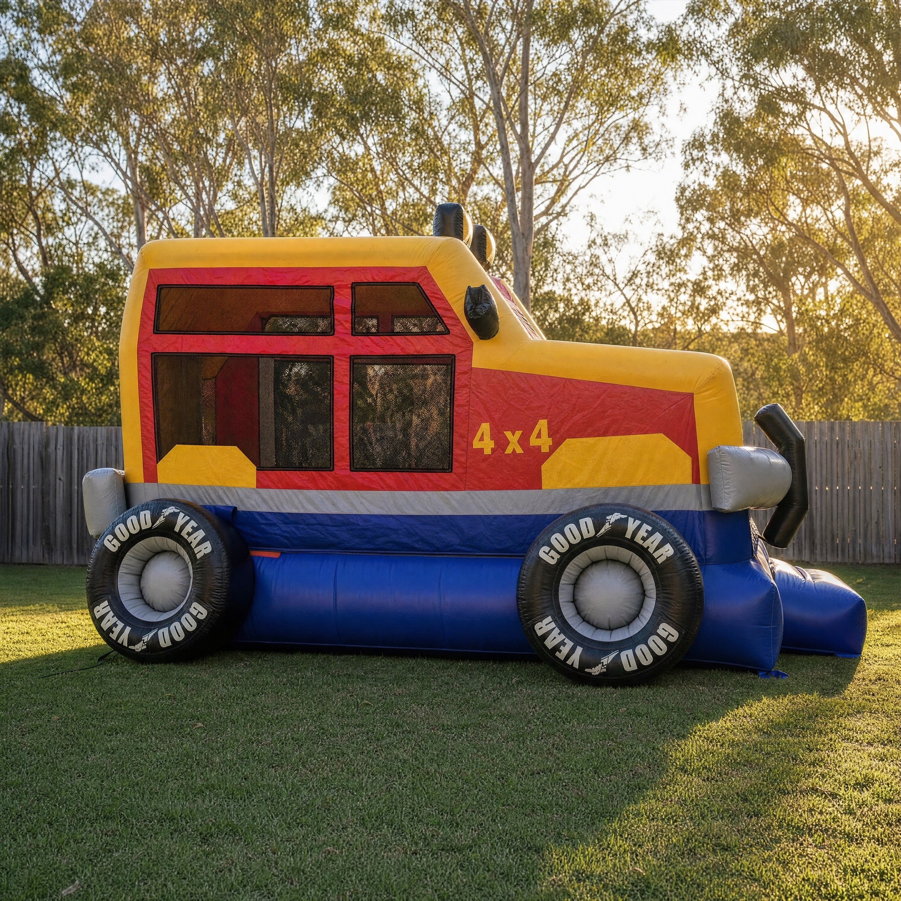 Monster Wheels Castle Combo hire side profile showing the 4x4 monster truck graphics