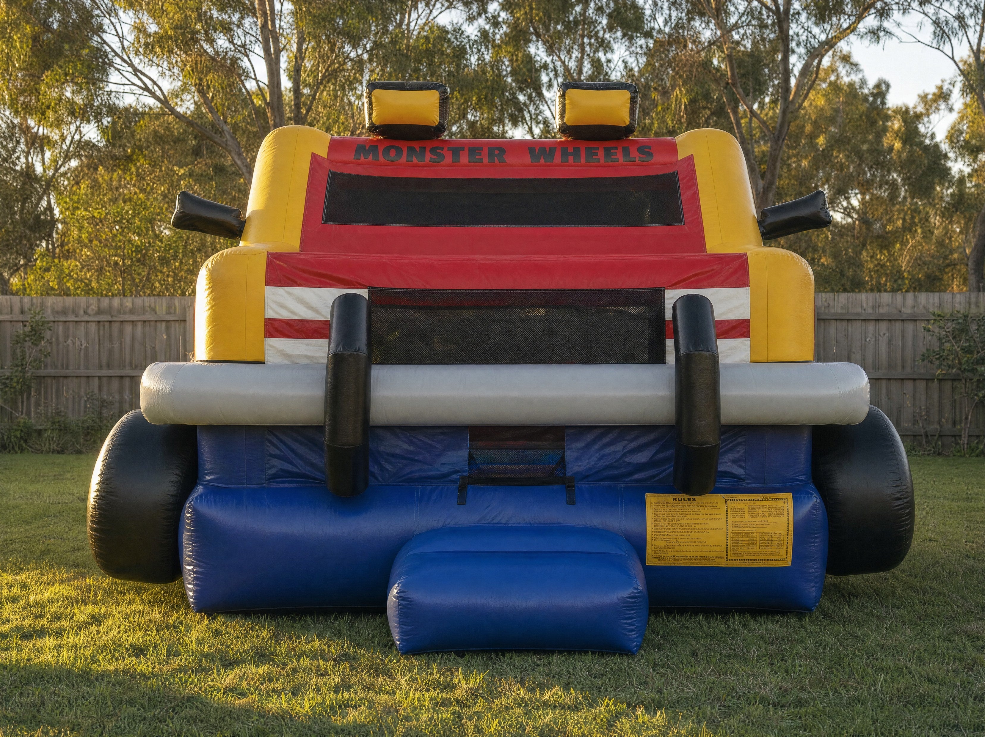 Monster Wheels Castle Combo hire front view showing the monster truck theme artwork