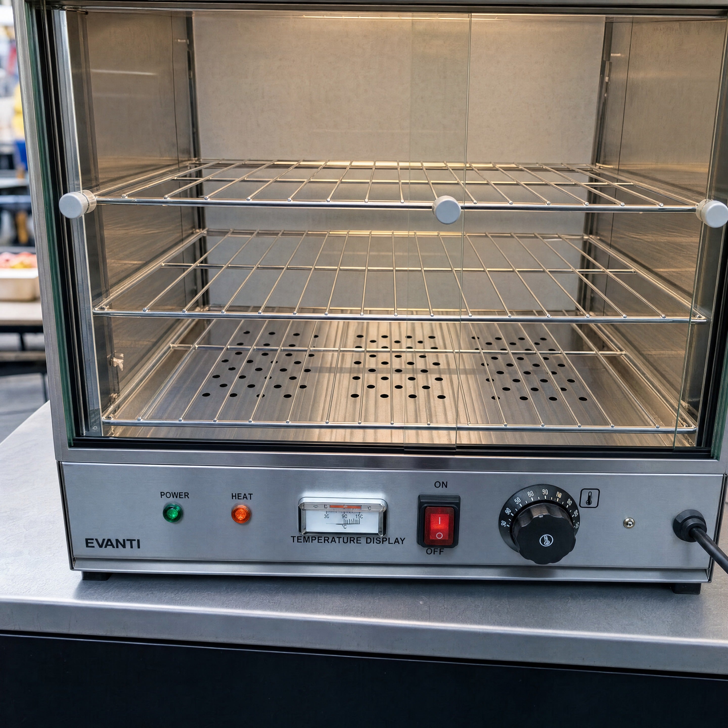 Pie warmer hire interior showing wire shelves and open glass door