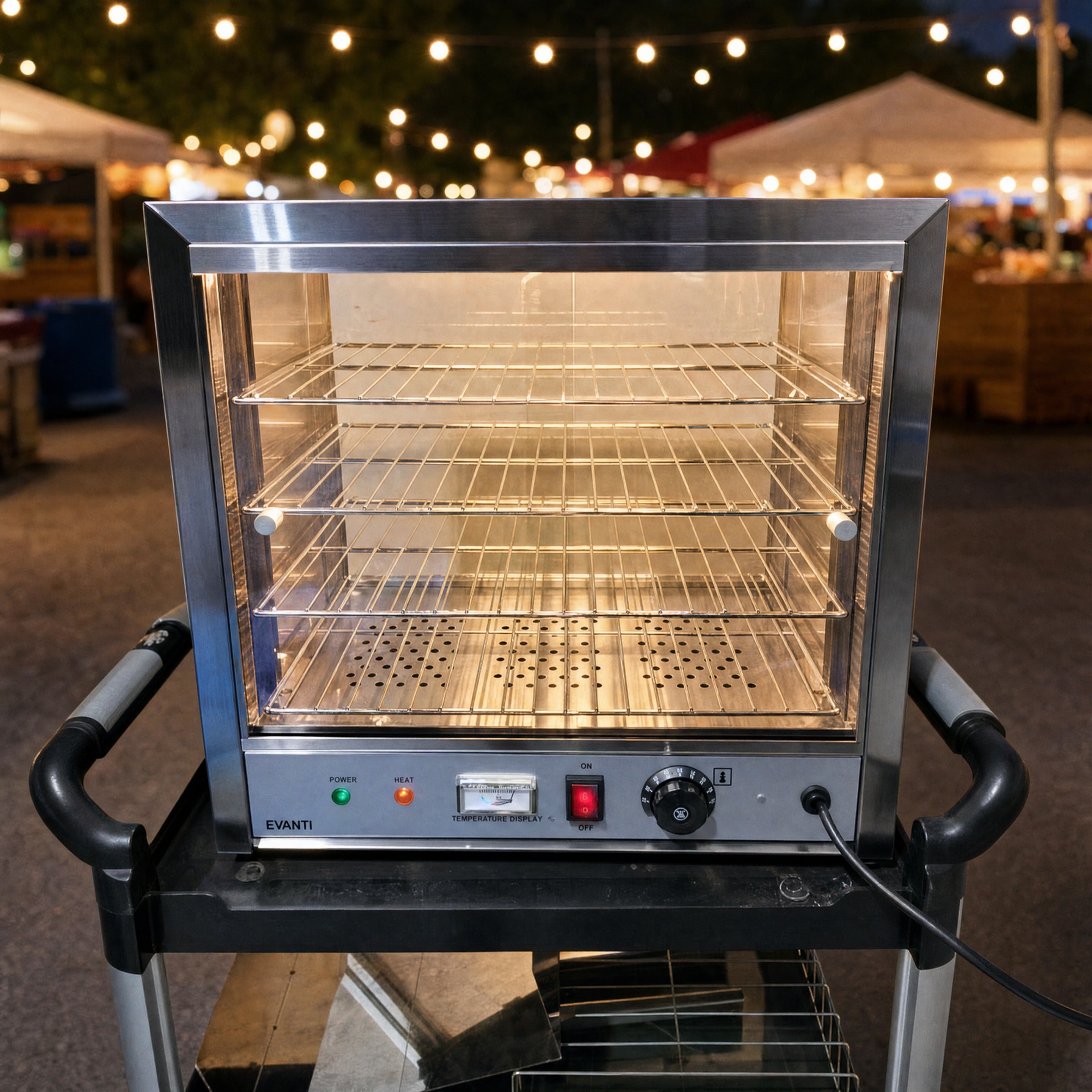 Pie warmer hire glowing warm at a Central Coast night market