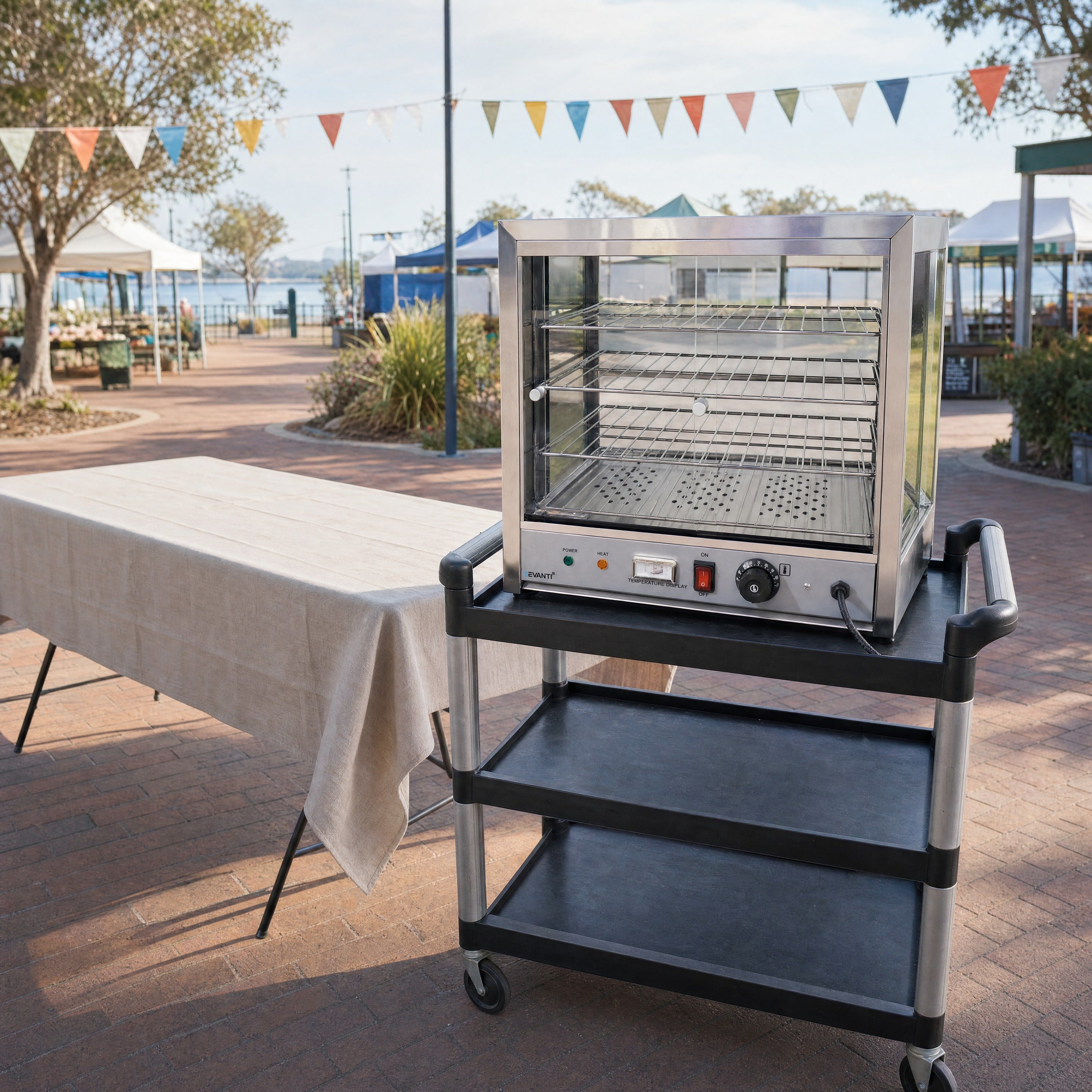 Pie warmer hire positioned beside a market stall trestle table