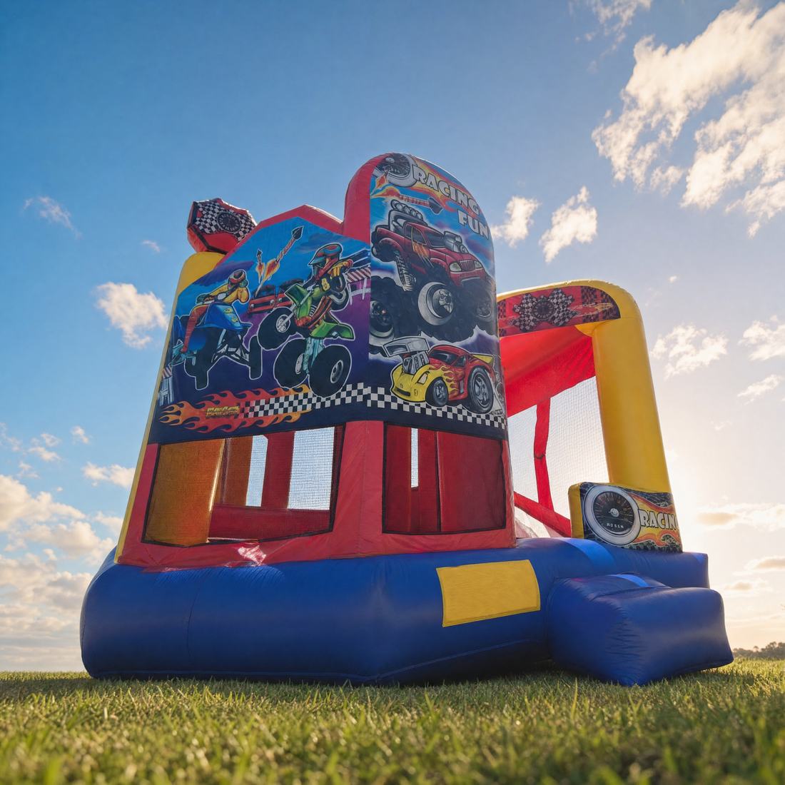 Low-angle view of the Racing Fun 5in1 Combo jumping castle against a blue sky