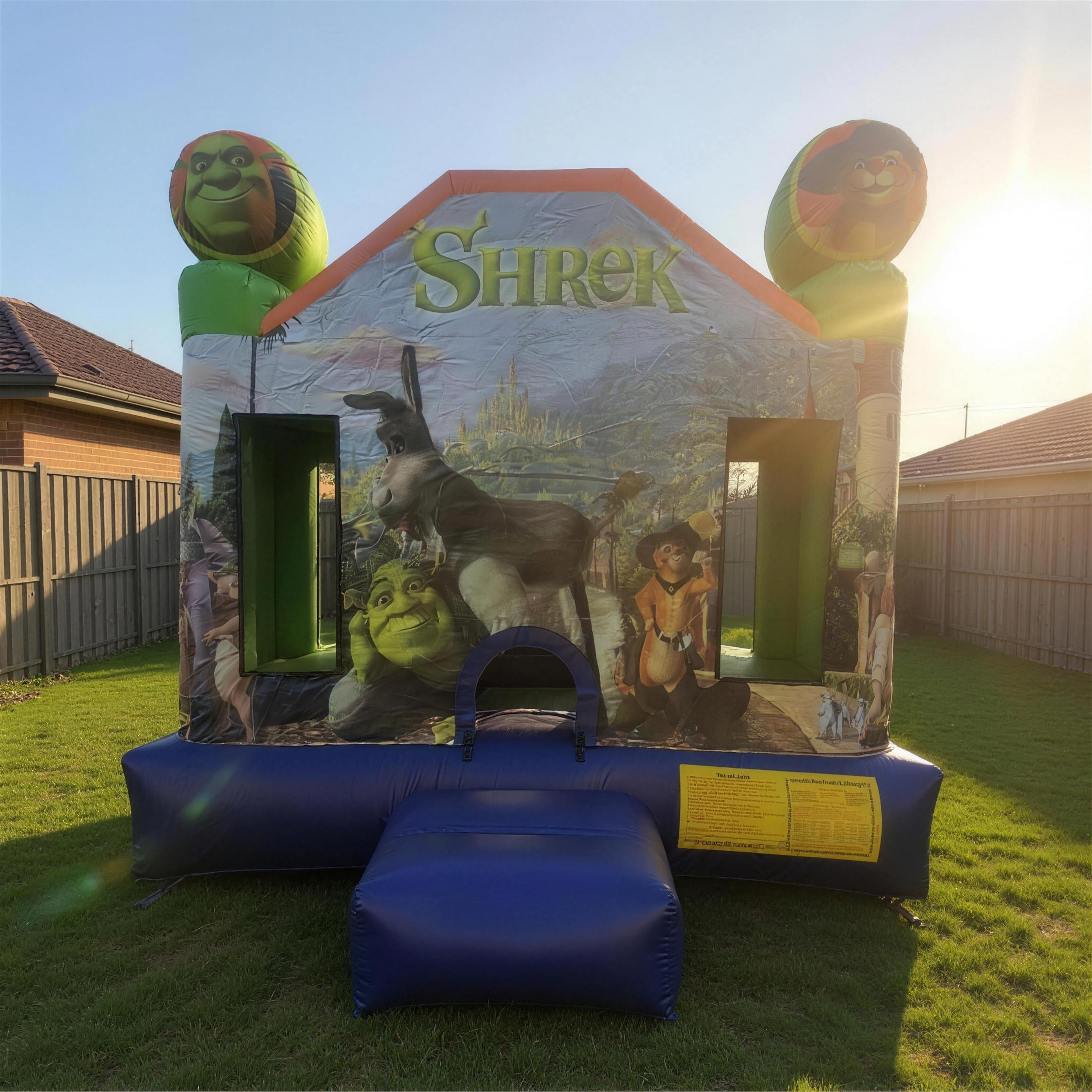 Shrek Jumping Castle Hire front three-quarter view on backyard grass Central Coast