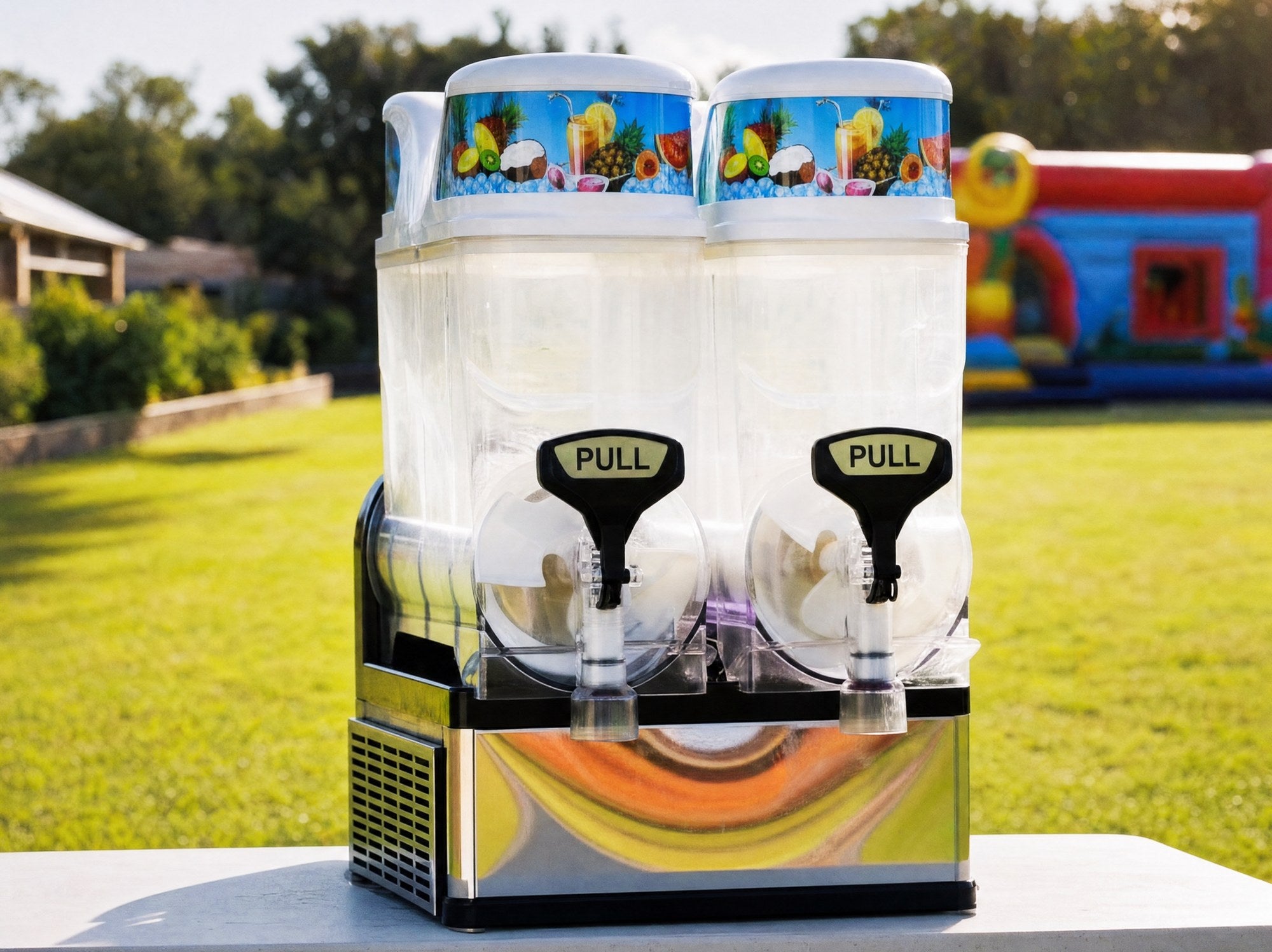 Straight-on wide view of a slushie machine on a table at a backyard party