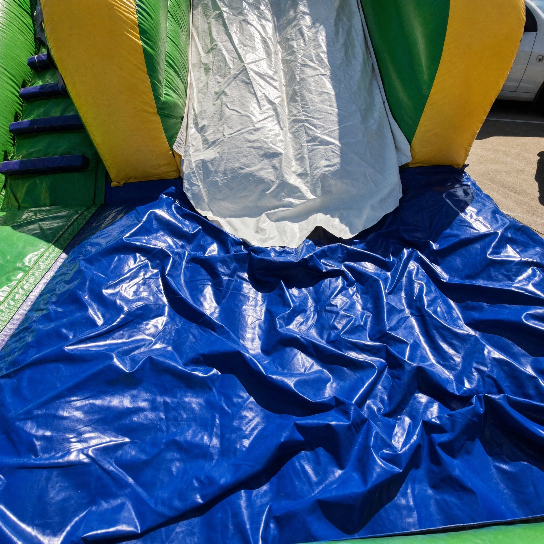 Close detail of the SS Splash Water Slide landing mat and slide chute base