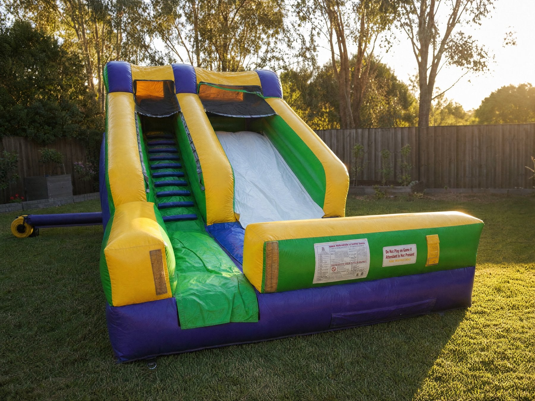 SS Splash Water Slide Hire, Central Coast, wide desktop hero view in a backyard