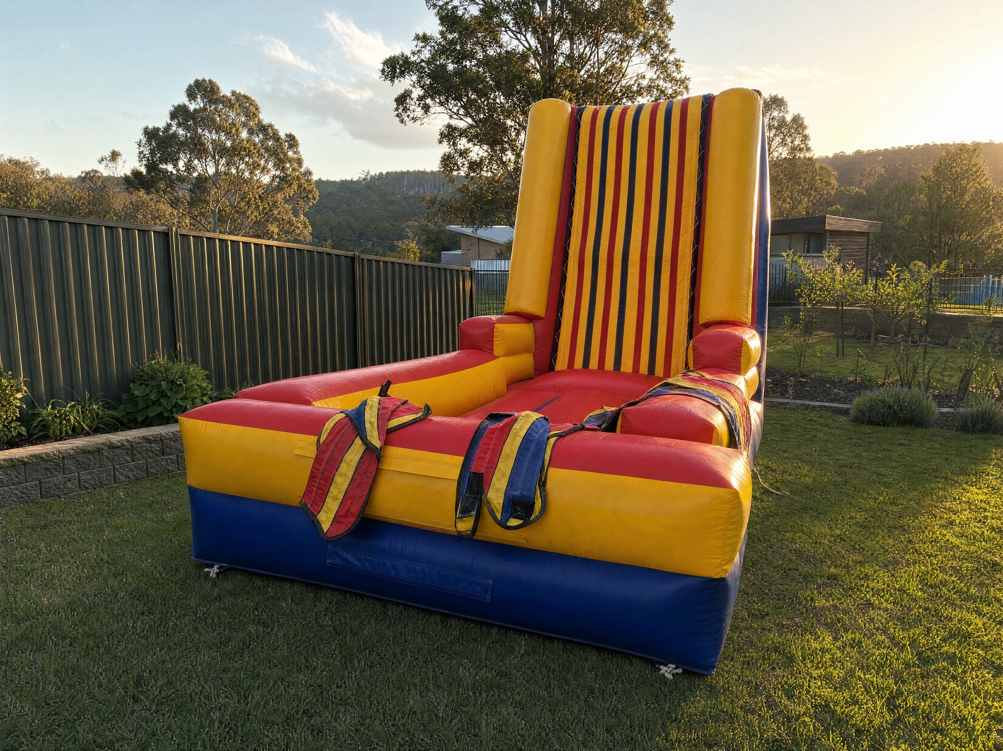Sticky Wall inflatable game set up in a backyard on the Central Coast at golden hour