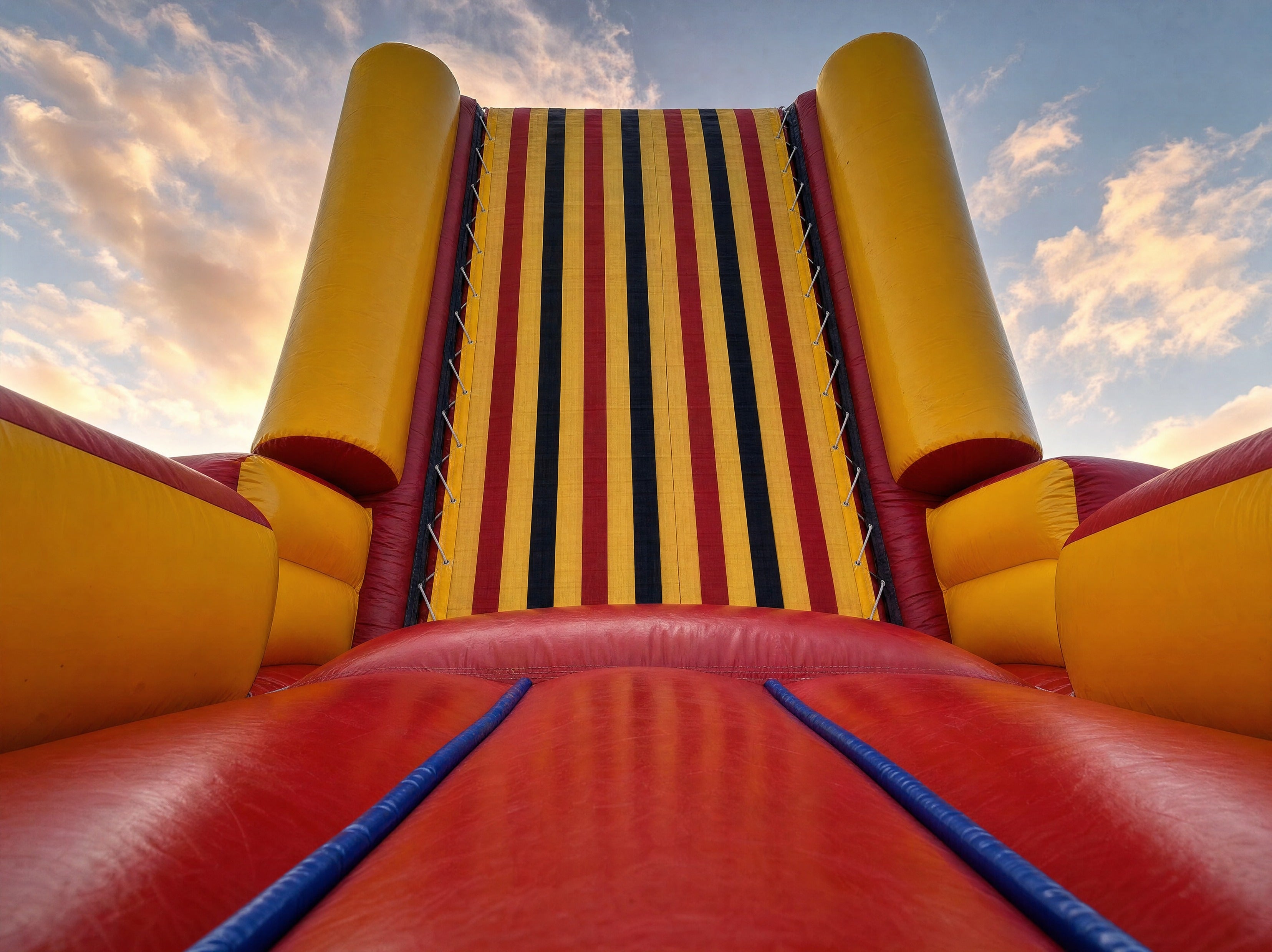 Low angle view looking up the striped velcro climbing panel on the Sticky Wall