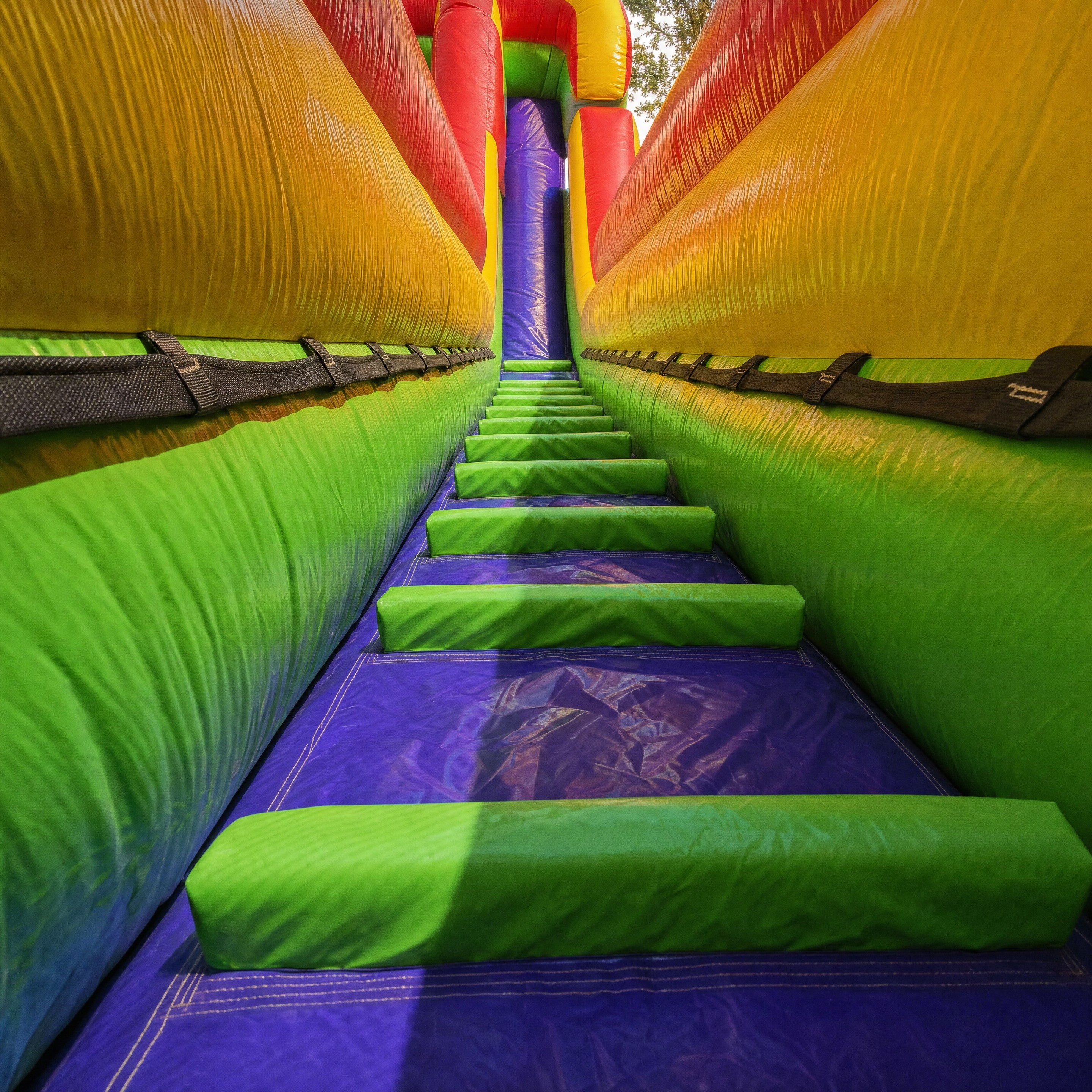 Interior view down the climbing chute of The Commander dry slide toward the entrance archway