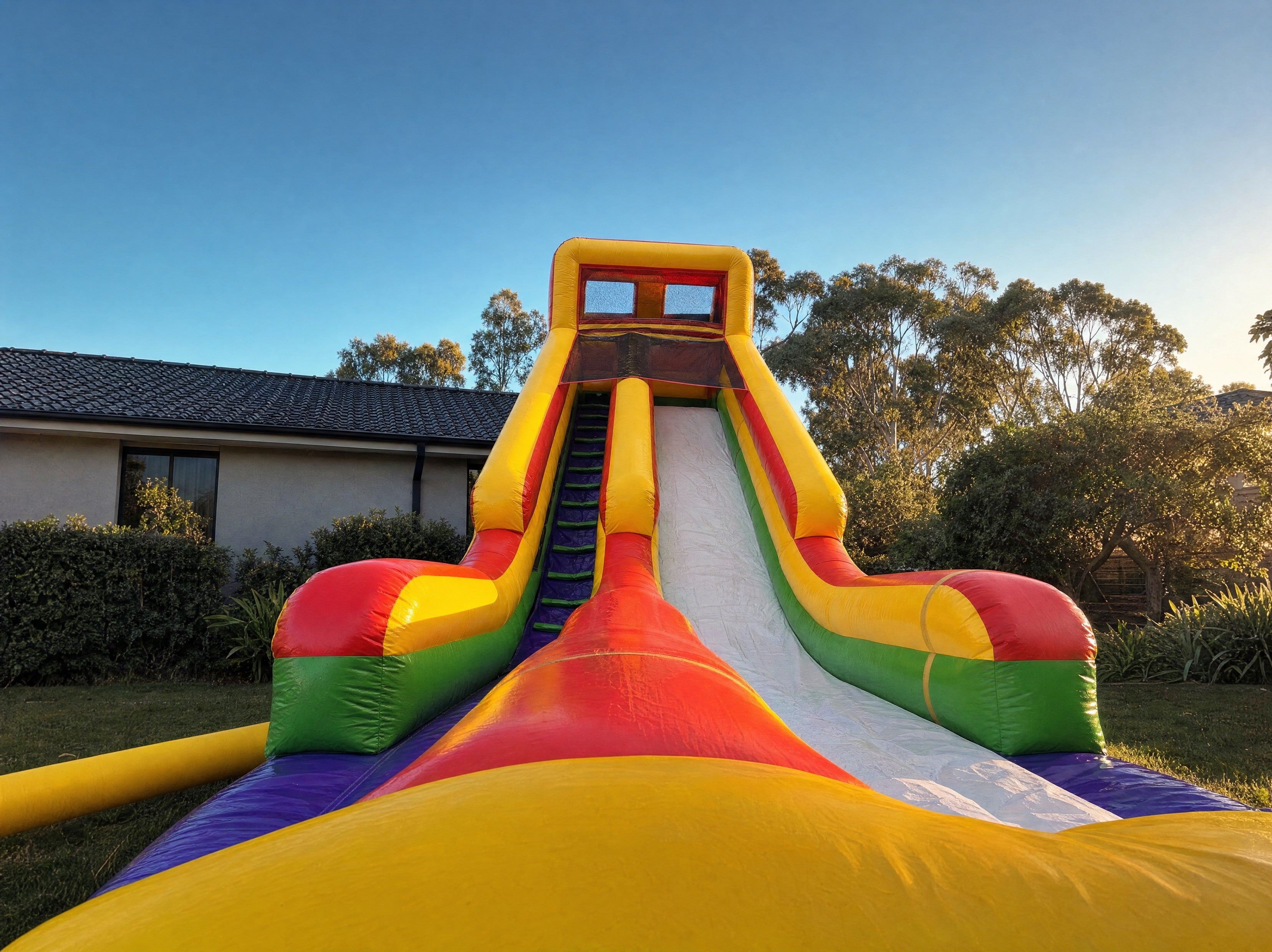 Wide low angle view of The Commander dry slide against a wide Central Coast sky