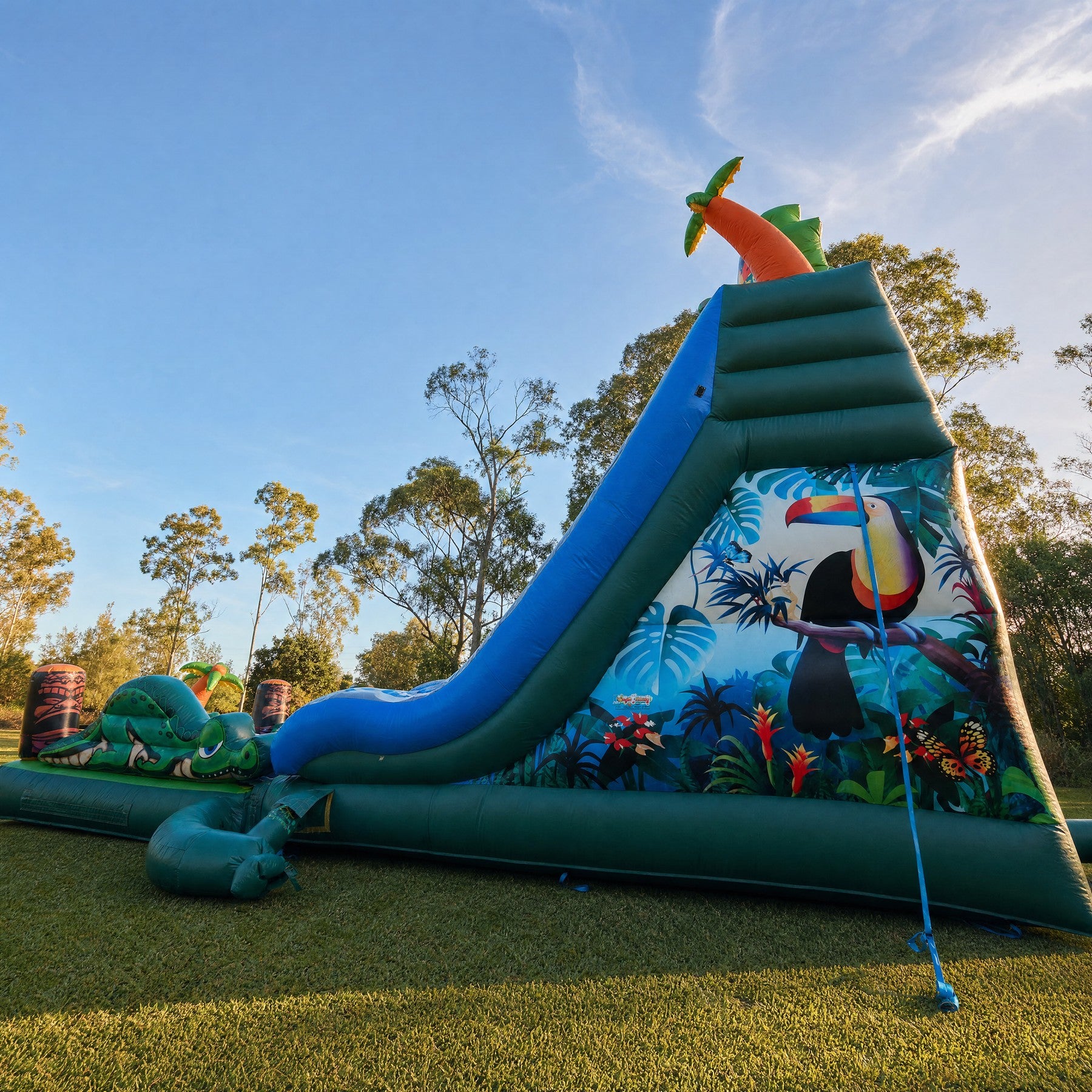 Tiki Falls Water Slide with Pool low angle view showing the full height and jungle mural side panel