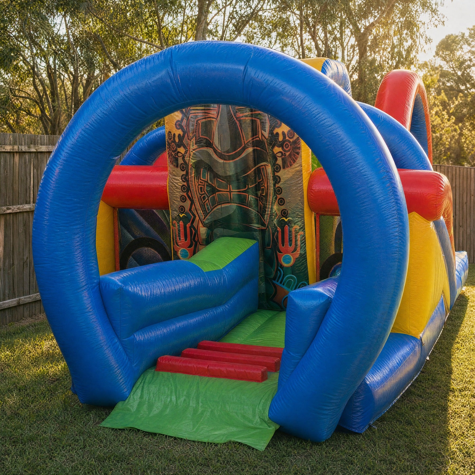 Close view of the Tiki Island inflatable entrance archway and tiki mask panel