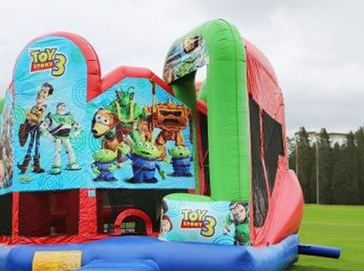 Toy Story 5in1 Combo Castle Hire, angled view of the jumping castle with slide