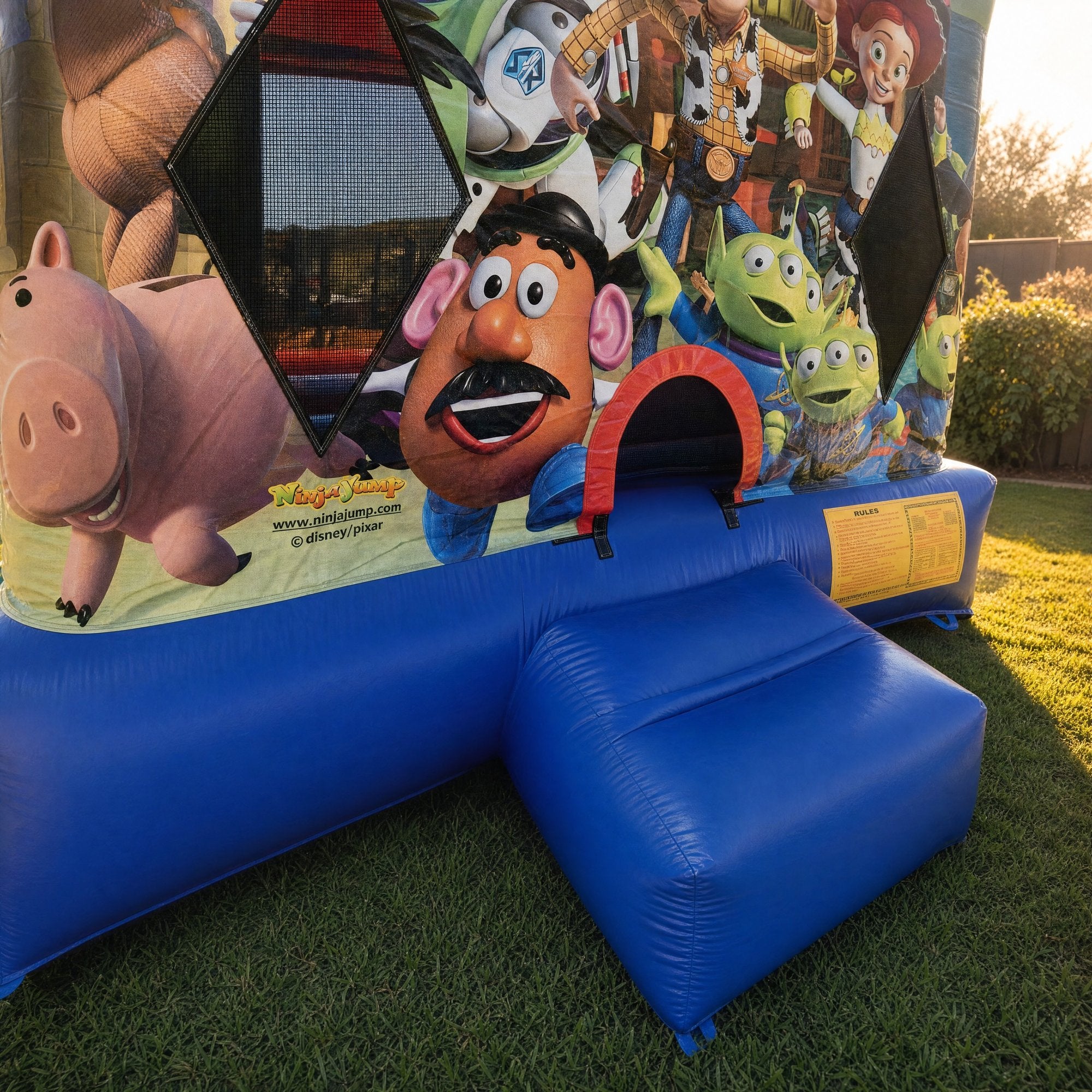 Toy Story Jumping Castle Hire entrance archway and safety placard detail, Jump About