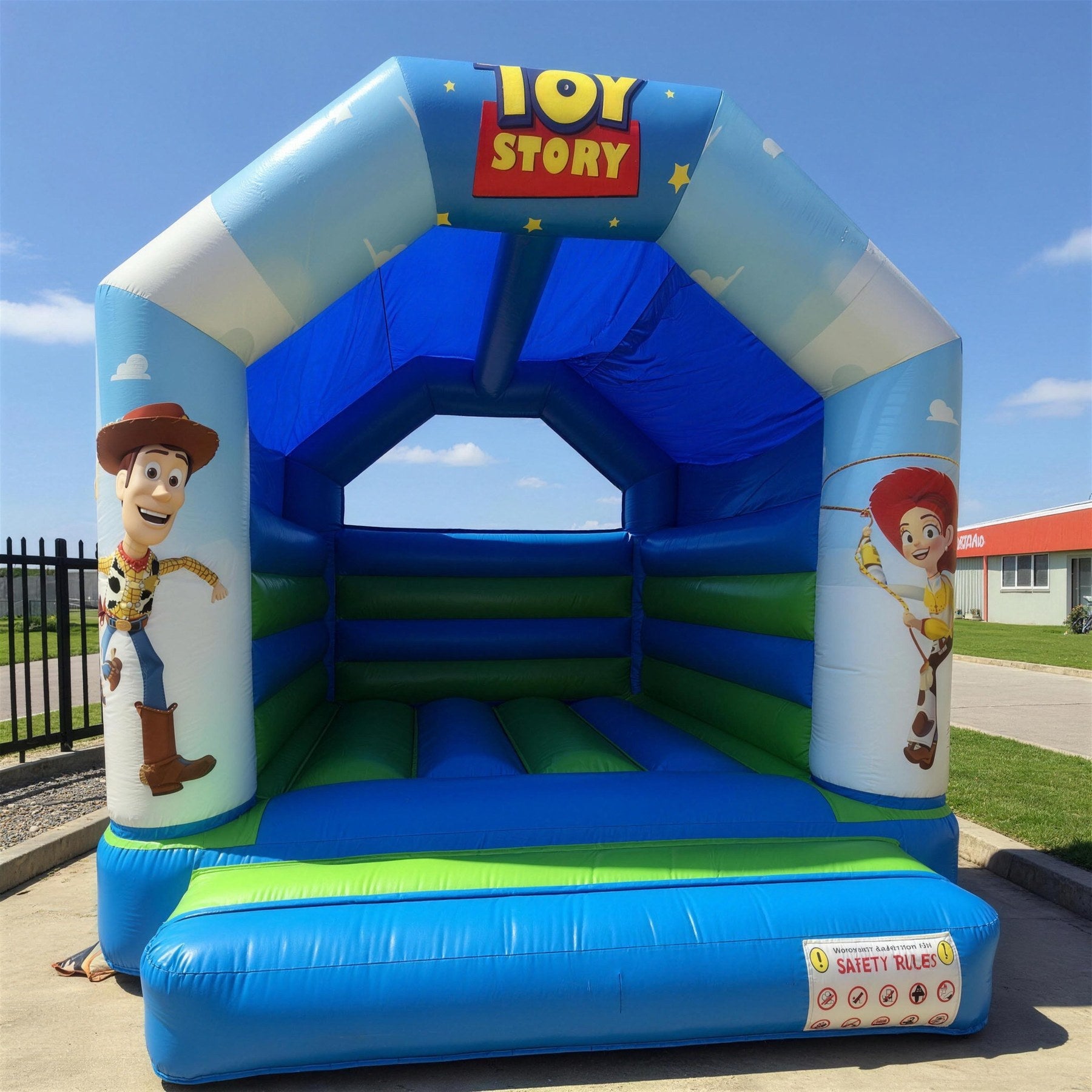 Three-quarter angle view of Toy Story open jumping castle entrance in a backyard