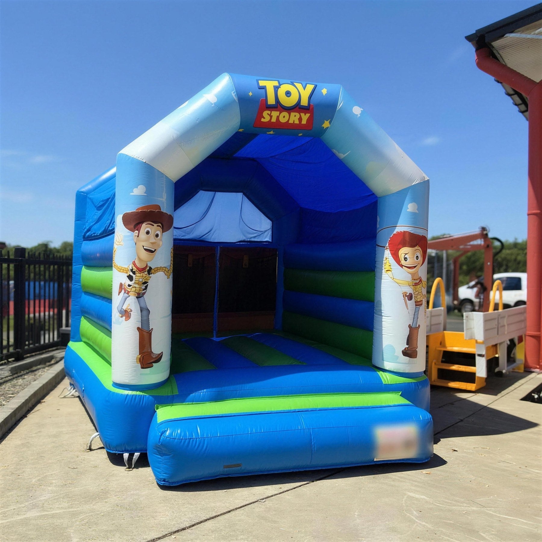 Toy Story open jumping castle in warm evening light in a suburban backyard