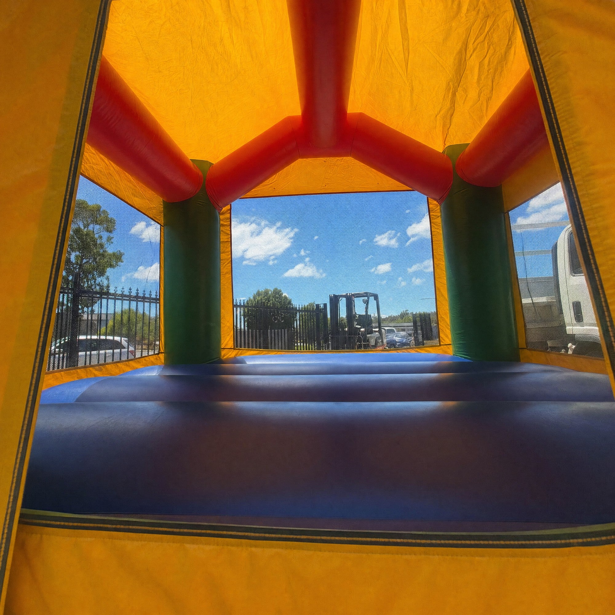 Inside the Tropical Island Jumping Castle looking out through the mesh windows