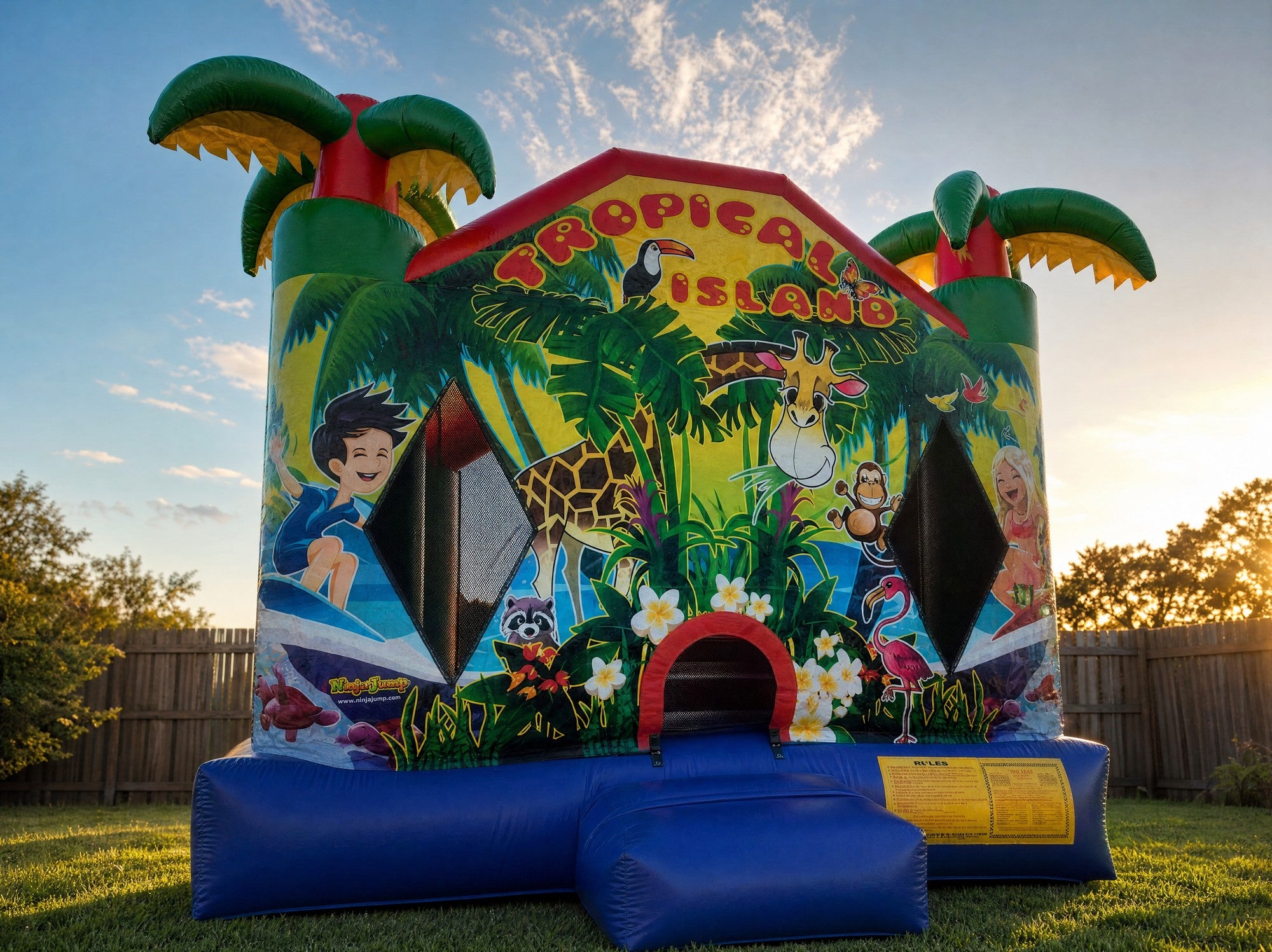 Low angle view of the Tropical Island Jumping Castle showing full palm tree toppers