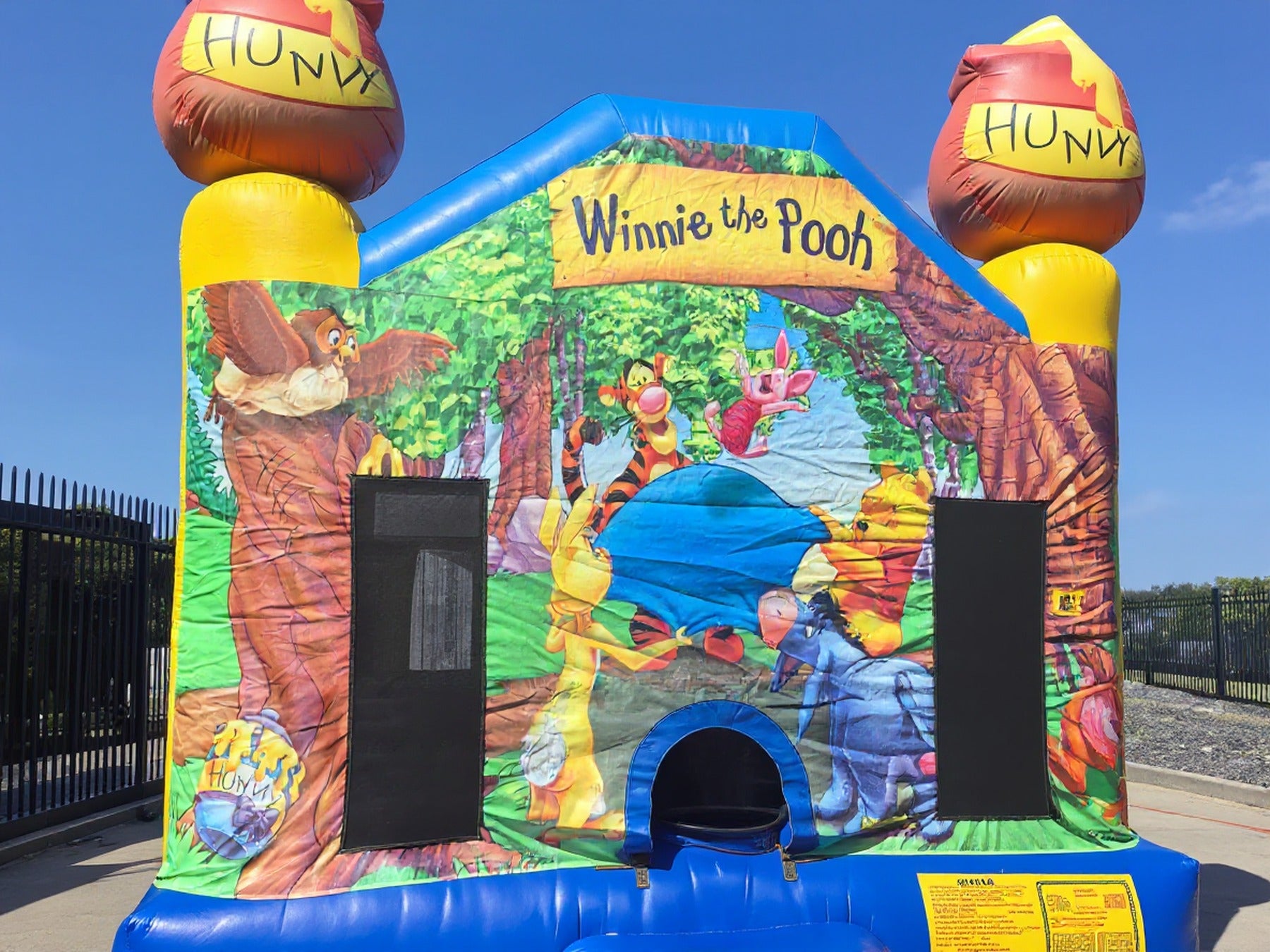 Low angle view of the Winnie the Pooh jumping castle honey pot topper