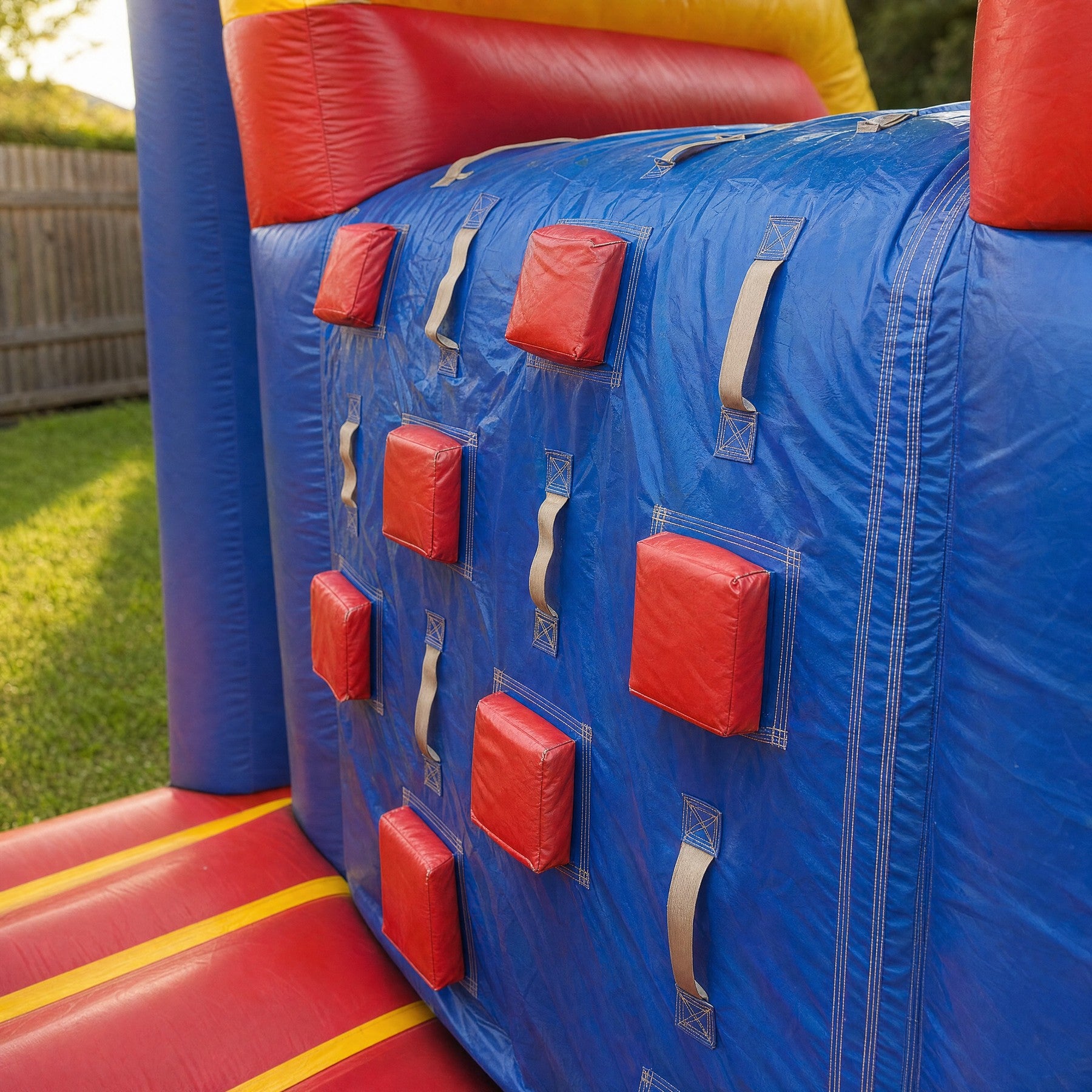 Padded grab-handle wall detail on the Wipe Out Inflatable game