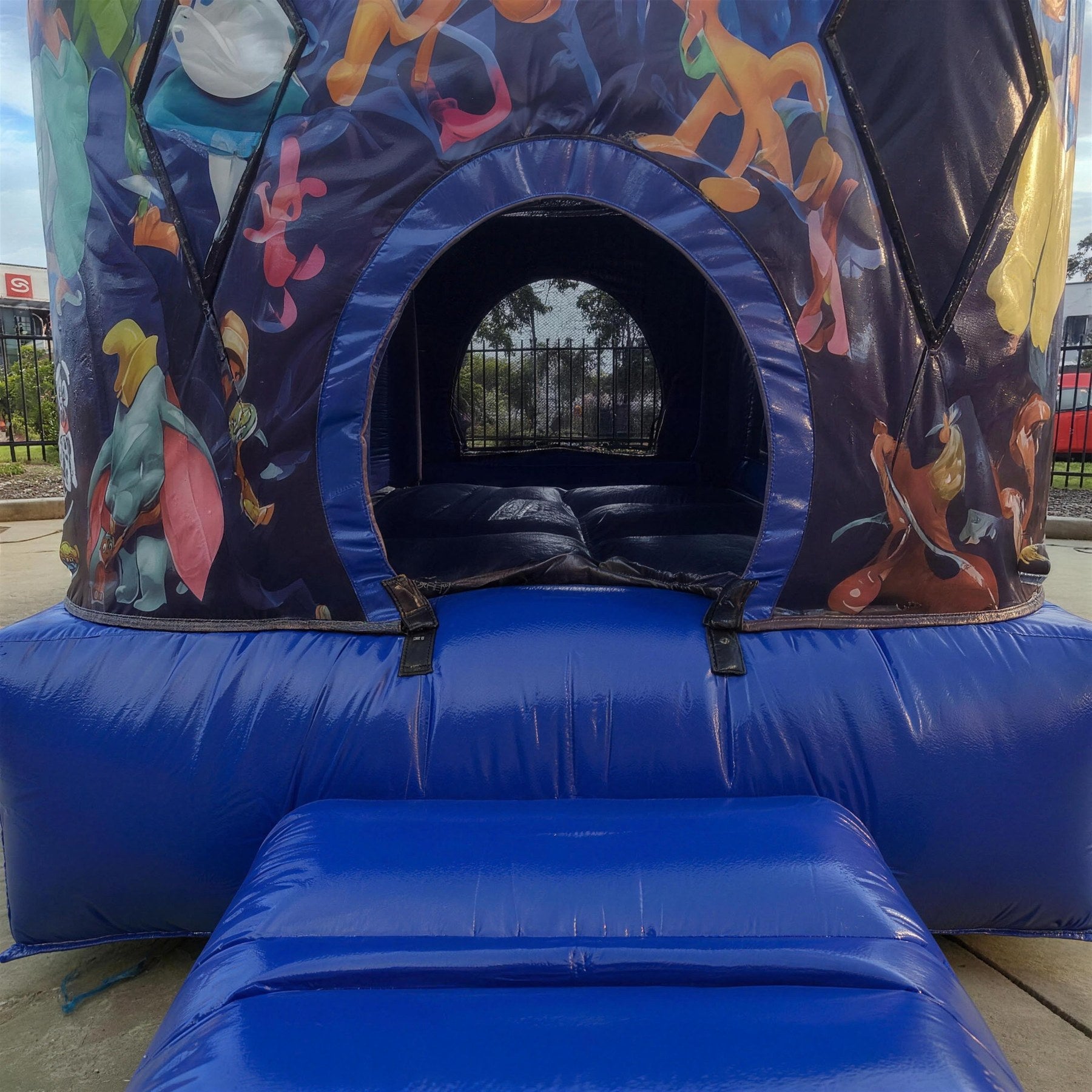 Entrance archway and landing mat of the World of Disney jumping castle